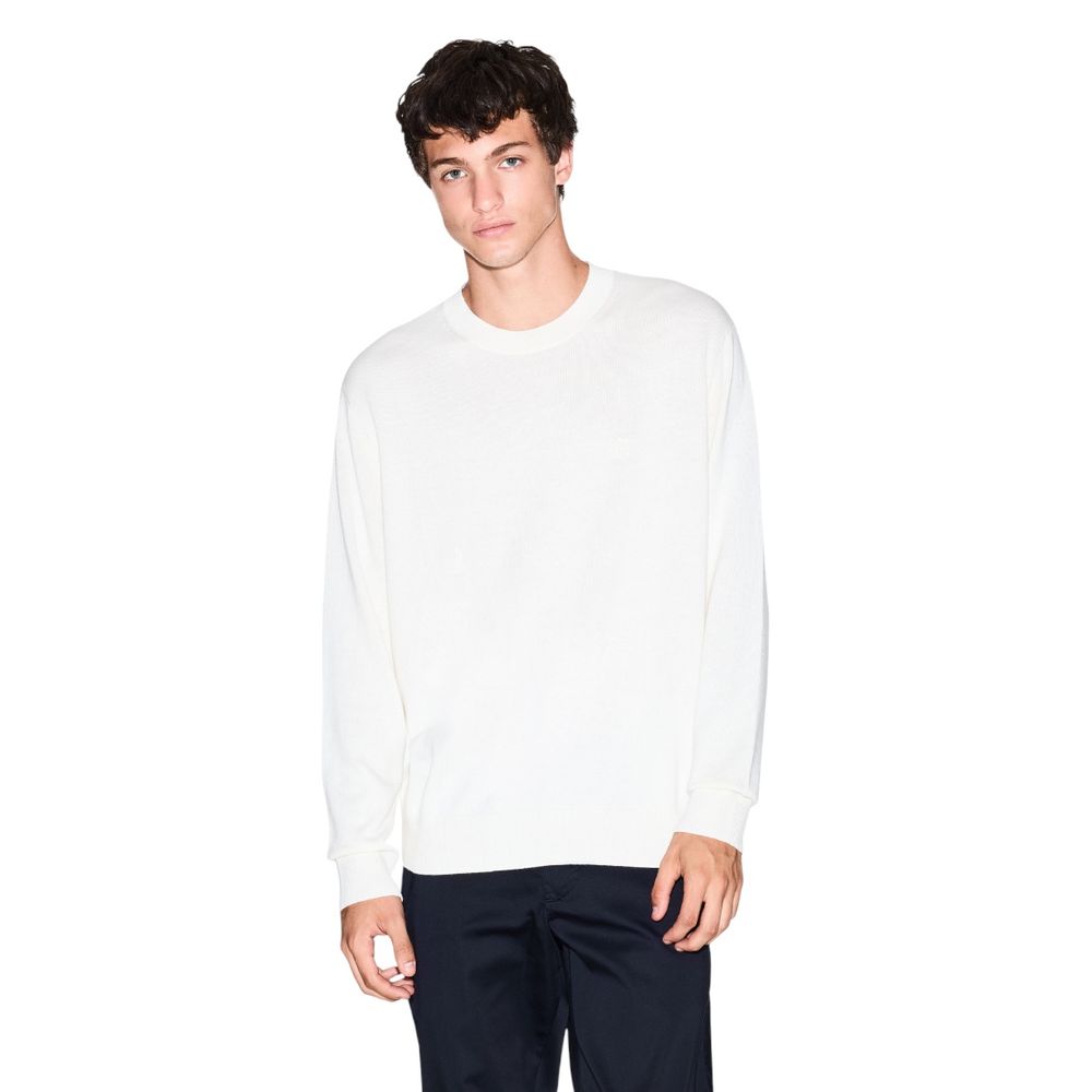 Indulge in the Armani Exchange Cream Viscose Sweatshirt, a masterpiece of refined knitwear blending viscose, cotton, and silk for timeless sophistication and effortless elegance.