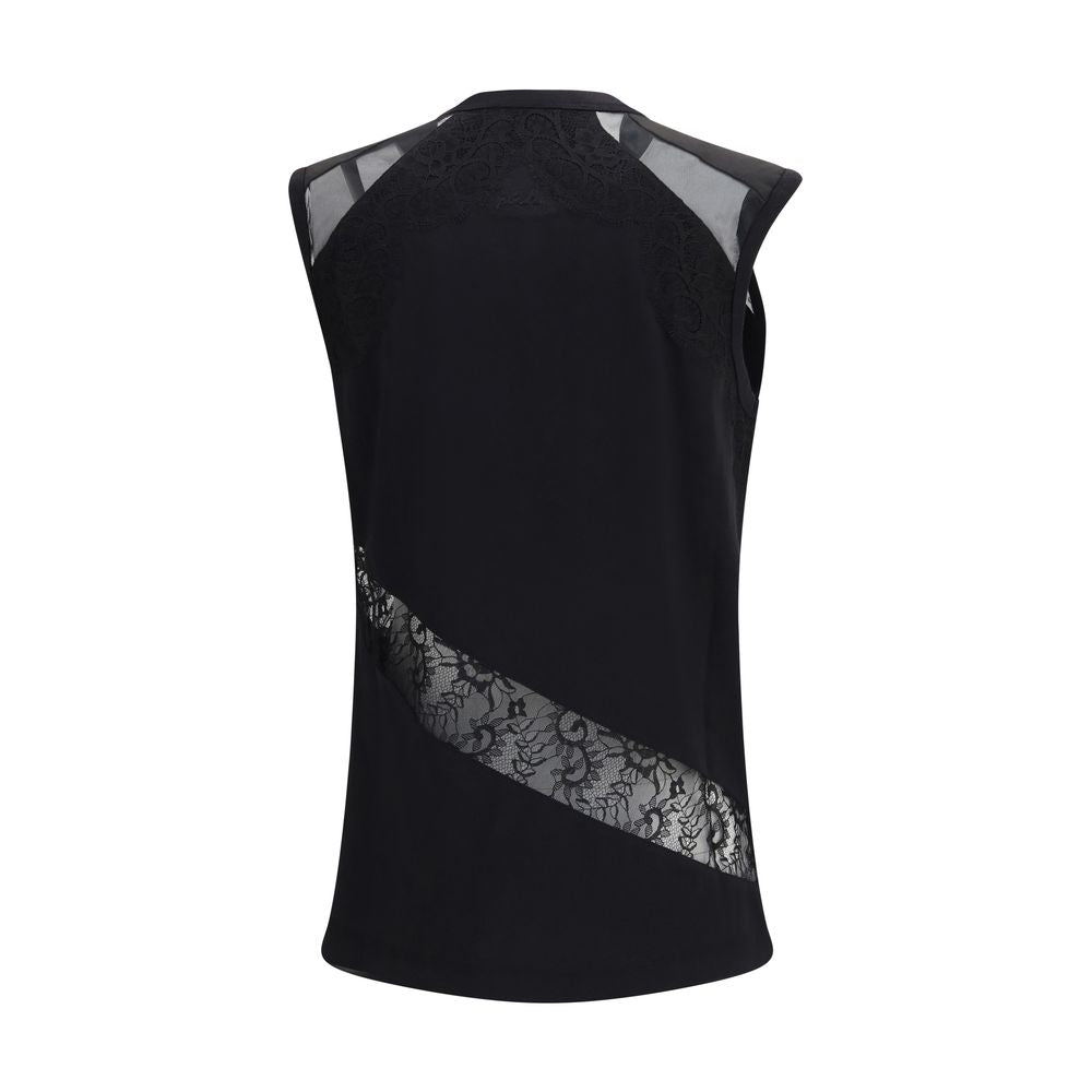 Discover the PINKO Black Cotton Blouse, a masterpiece of soft cotton jersey and lace details, embodying luxury and sophistication for the modern connoisseur.
