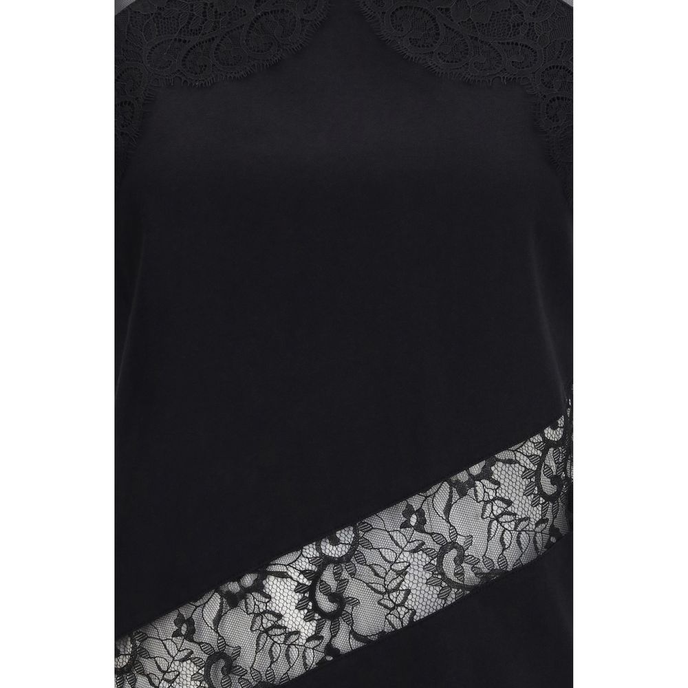 Elevate your wardrobe with the PINKO Black Cotton Blouse, a masterpiece of soft cotton jersey and exquisite lace details, embodying timeless luxury and sophistication.