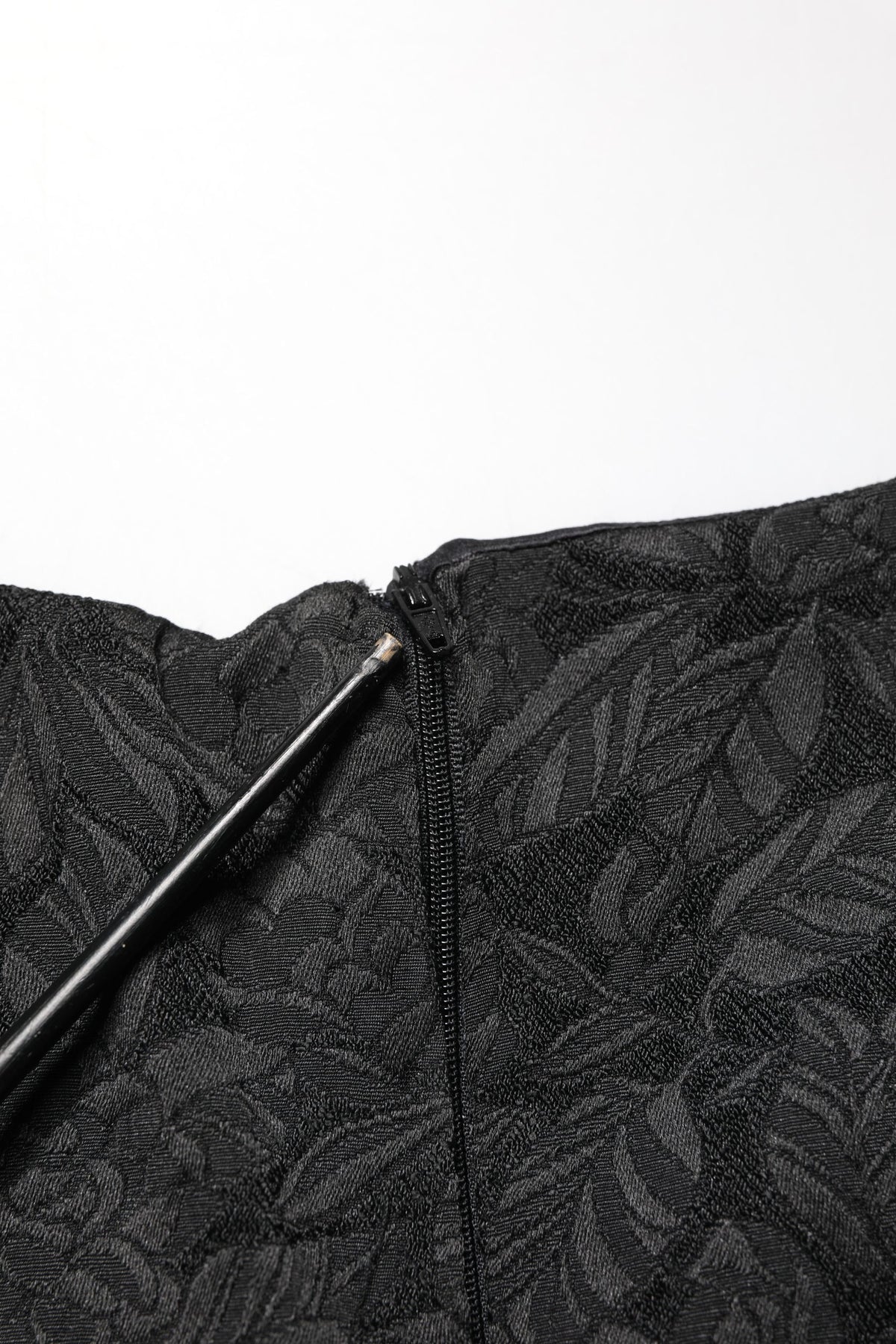 Elevate your wardrobe with the Dolce & Gabbana Black Floral Brocade Sheath Dress, a masterpiece of Italian craftsmanship that embodies timeless elegance and sophistication.