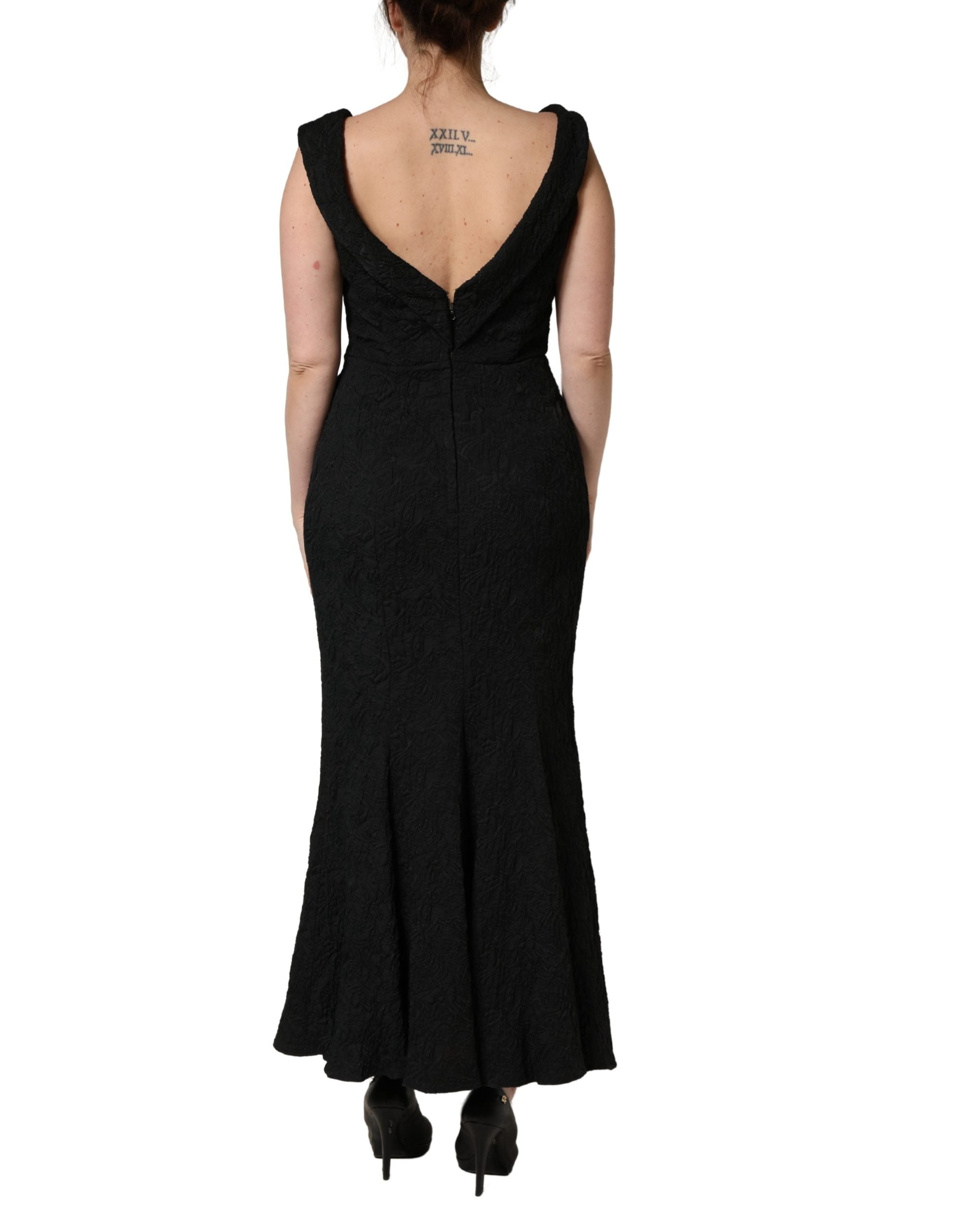 Indulge in the exquisite Dolce & Gabbana Black Floral Brocade Sheath Mermaid Dress, a masterpiece of Italian craftsmanship that embodies timeless elegance and allure.