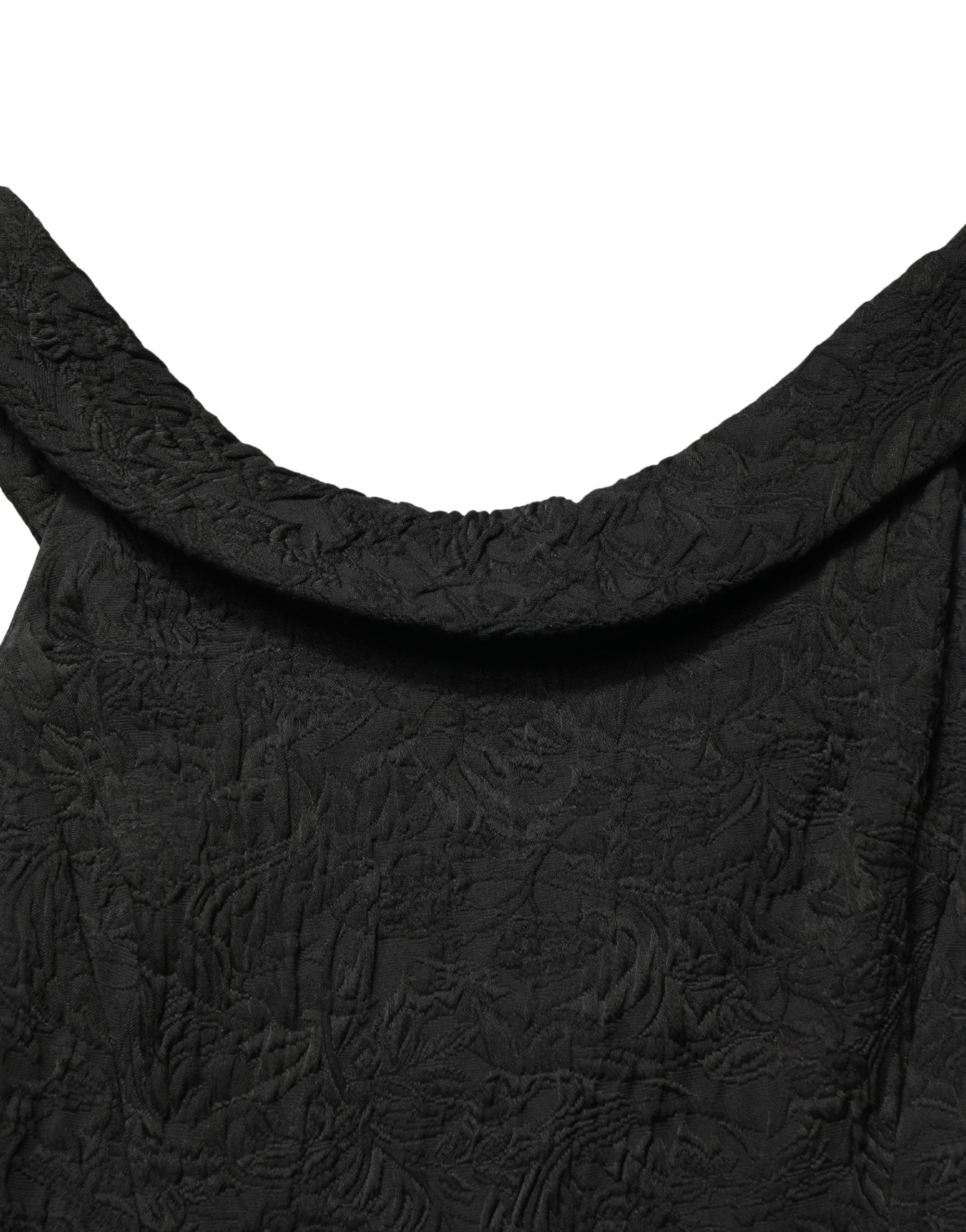 Indulge in the exquisite allure of the Dolce & Gabbana Black Floral Brocade Sheath Mermaid Dress, a masterpiece of Italian craftsmanship that elevates elegance and sophistication.