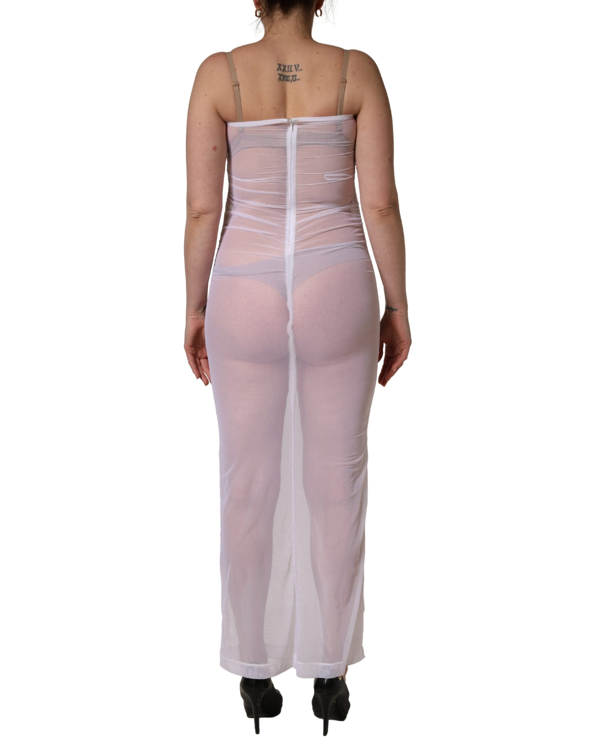 Experience the allure of the Dolce & Gabbana White Sheer Nylon Stretch Sheath Maxi Dress, a masterpiece of Italian craftsmanship that embodies timeless elegance and sophistication.