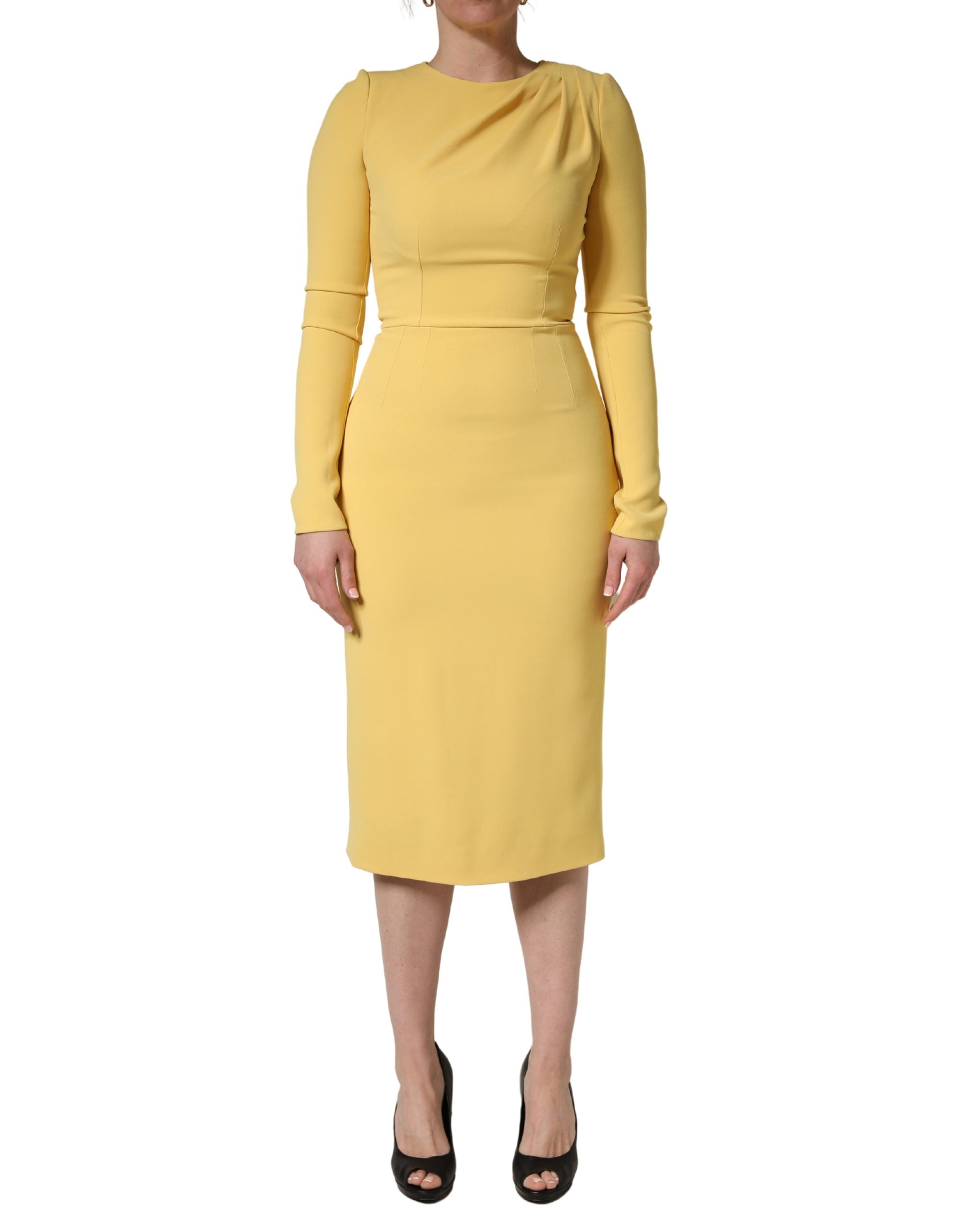 Experience the allure of the Dolce & Gabbana Yellow Silk Long Sleeves Sheath Midi Dress, a masterpiece of Italian craftsmanship that redefines elegance for any occasion.