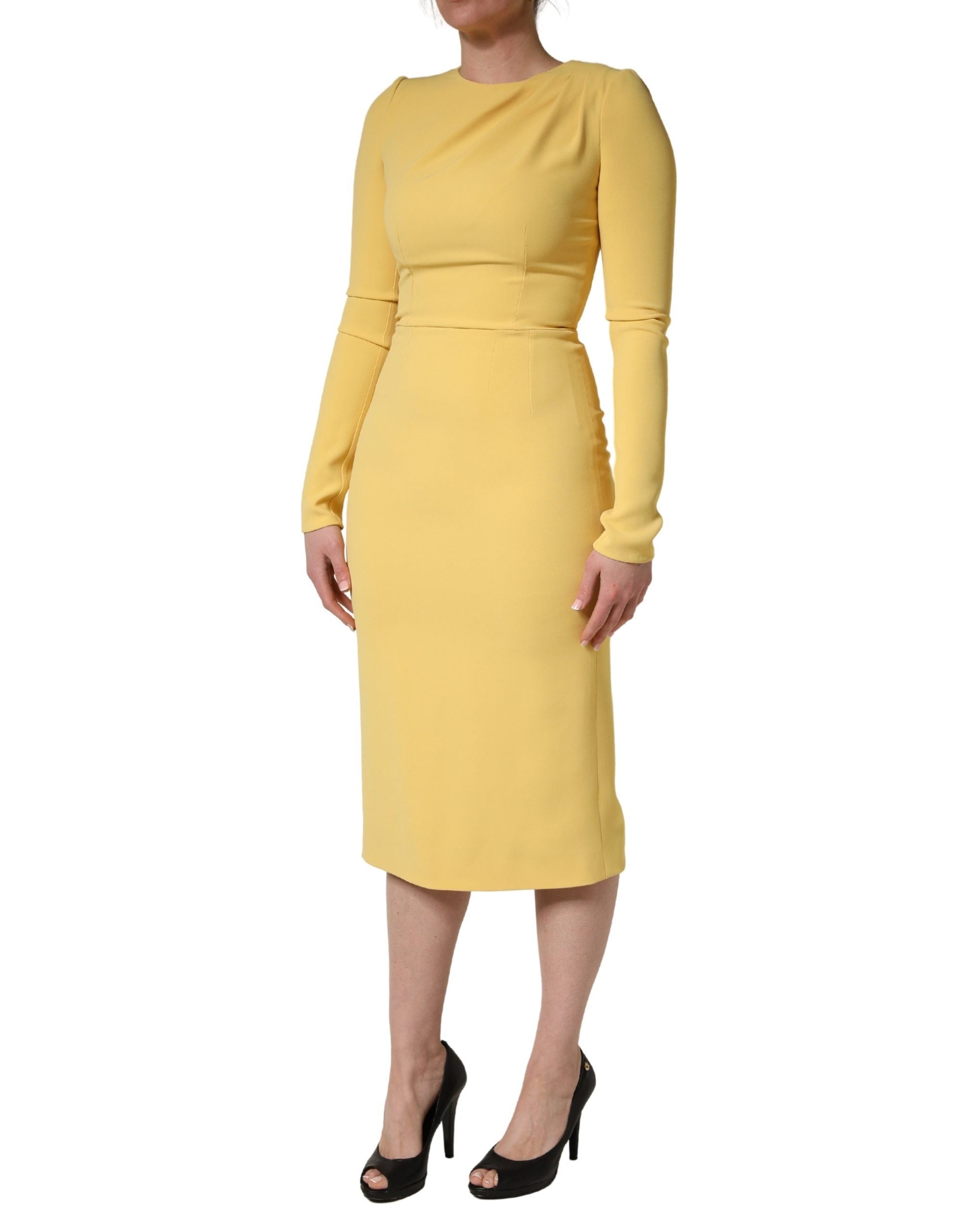 Experience the exquisite allure of the Dolce & Gabbana Yellow Silk Long Sleeves Sheath Midi Dress, a testament to Italian craftsmanship and timeless elegance for any sophisticated occasion.