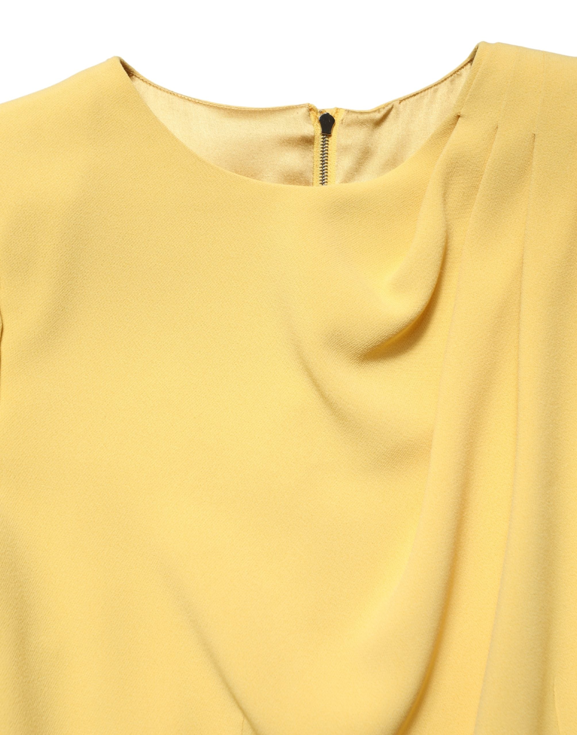 Elevate your wardrobe with the Dolce & Gabbana Yellow Silk Long Sleeves Sheath Midi Dress, a masterpiece of Italian craftsmanship that embodies timeless elegance and allure.