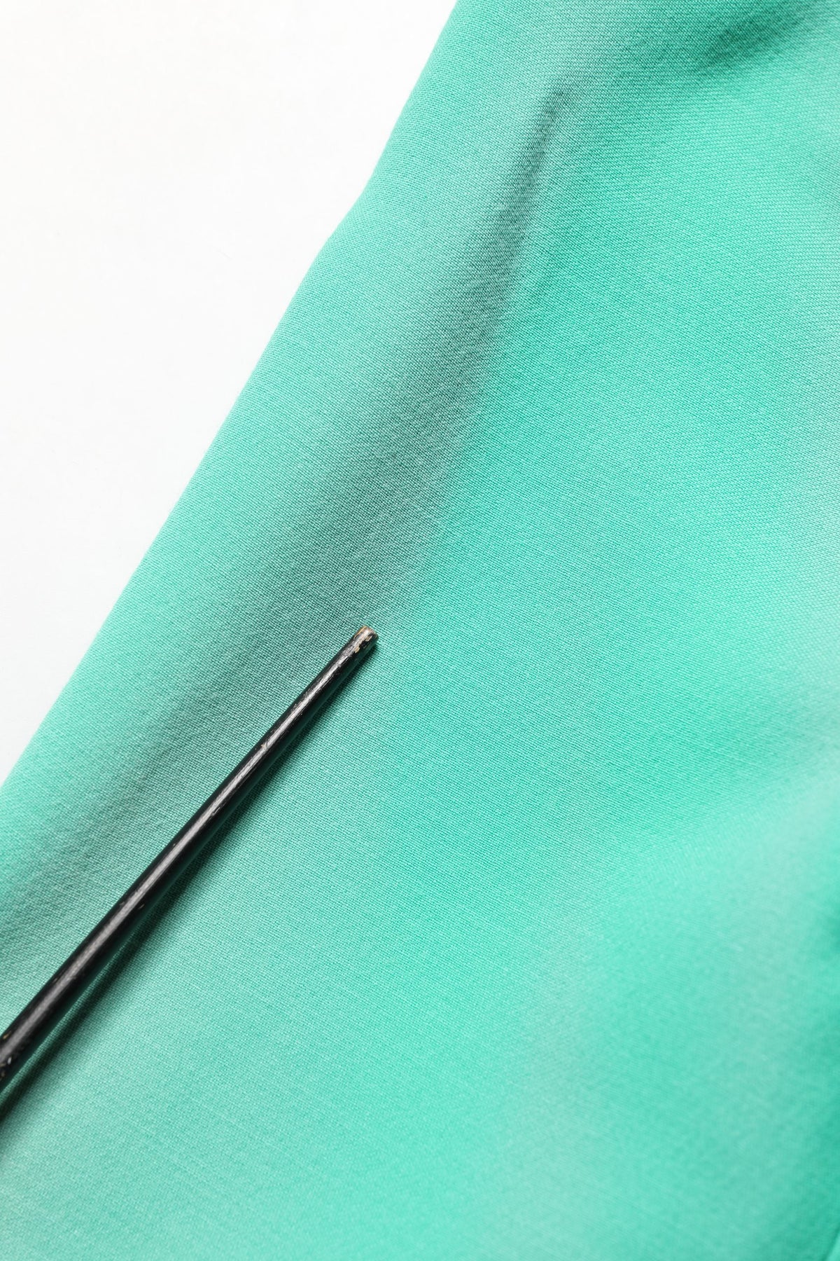 Elevate your wardrobe with the Dolce & Gabbana Green Buttoned Down Belt Trench Coat, crafted from luxurious virgin wool, embodying timeless elegance and exquisite Italian craftsmanship.