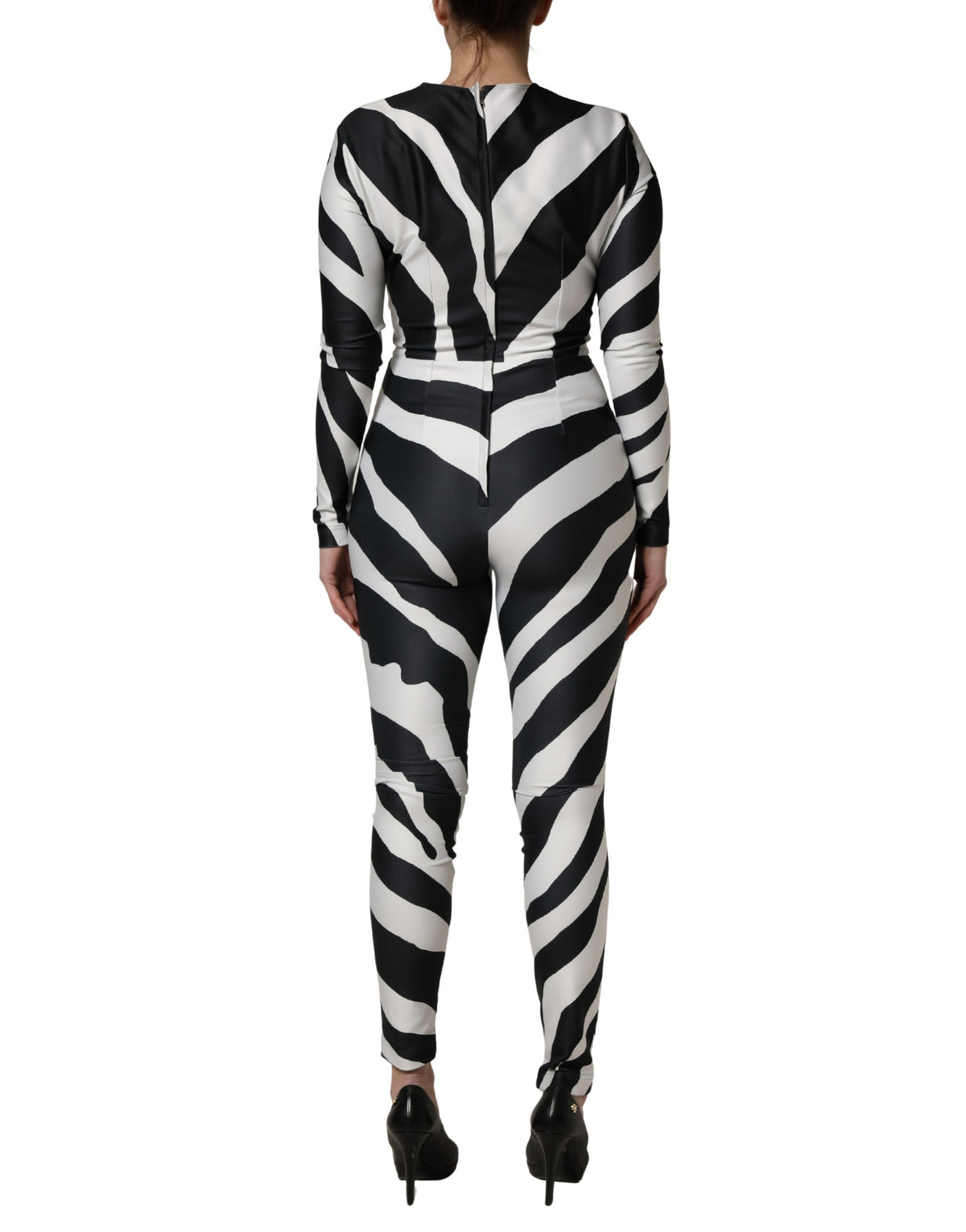 Elevate your wardrobe with the Dolce & Gabbana Black White Zebra Pattern Jumpsuit, a luxurious blend of elegance and boldness, crafted in Italy for the discerning individual.
