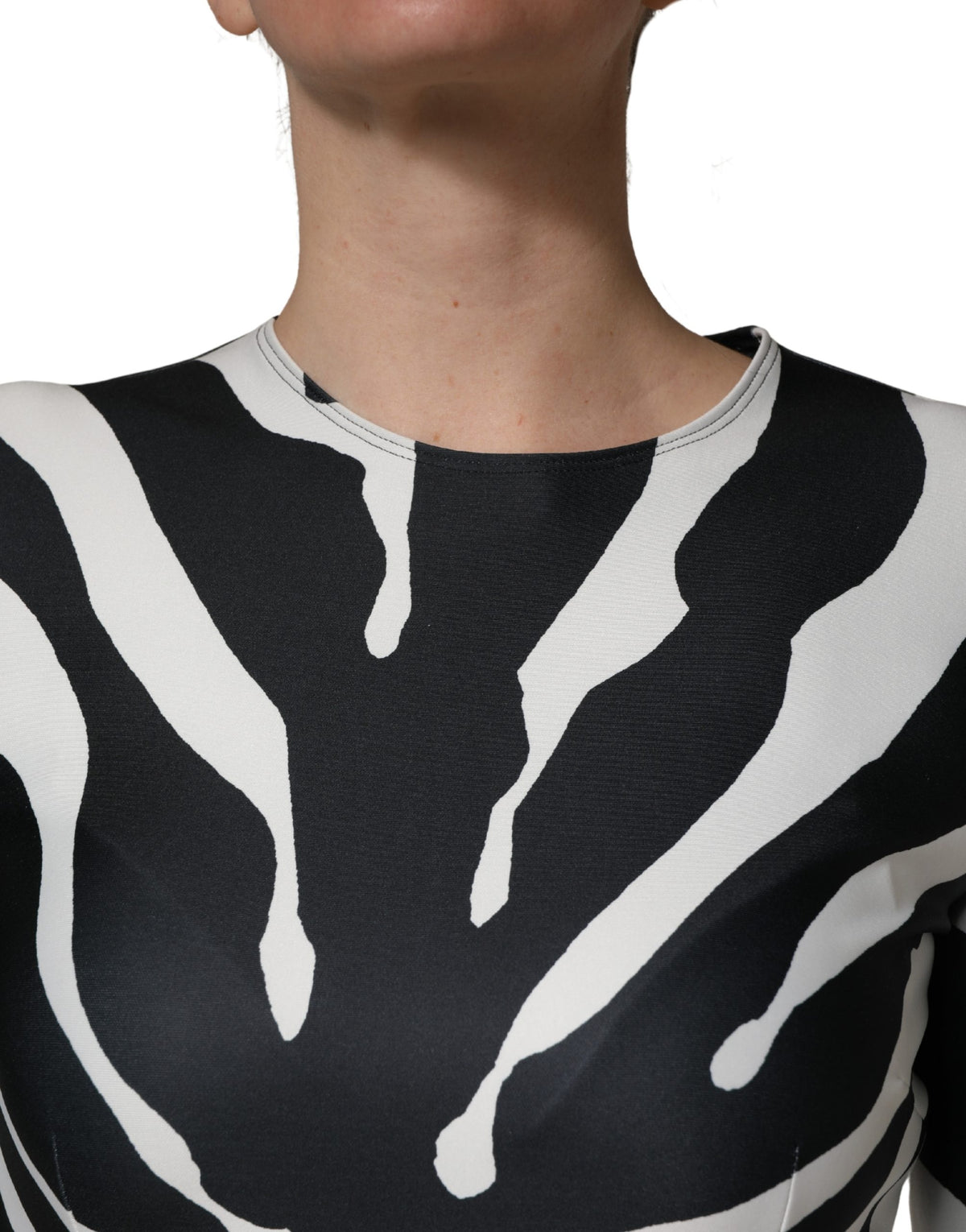 Elevate your wardrobe with the Dolce & Gabbana Black White Zebra Pattern Jumpsuit, a luxurious blend of exquisite craftsmanship and bold elegance, perfect for any occasion.