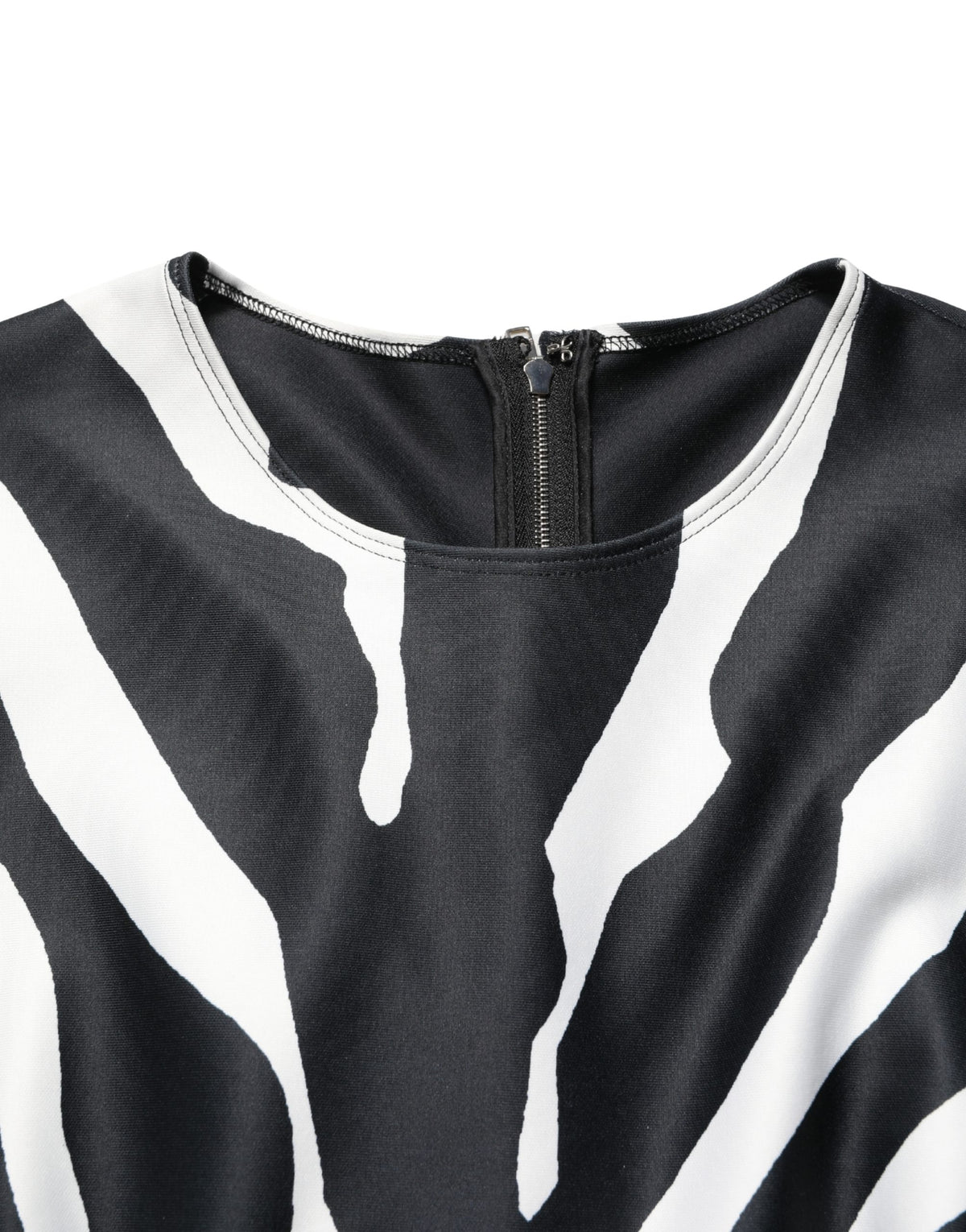 Indulge in the exquisite allure of the Dolce & Gabbana Zebra Pattern Jumpsuit, a luxurious blend of 93% polyester and 7% elastane, crafted for those who command elegance.