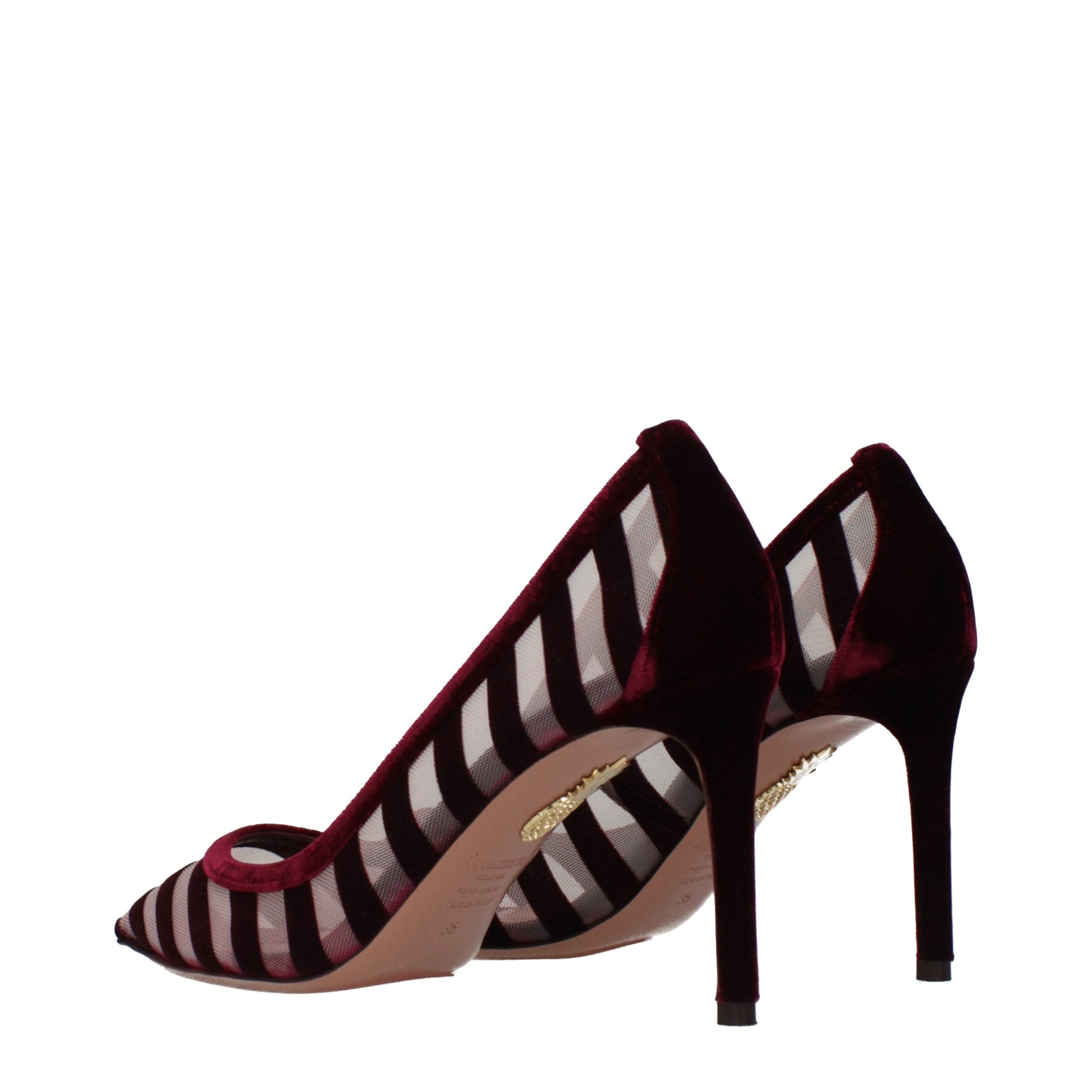 Step into a realm of sophistication with Aquazzura's Transparent Velvet Mid Heel Pumps, where exquisite craftsmanship meets timeless elegance for the discerning connoisseur.