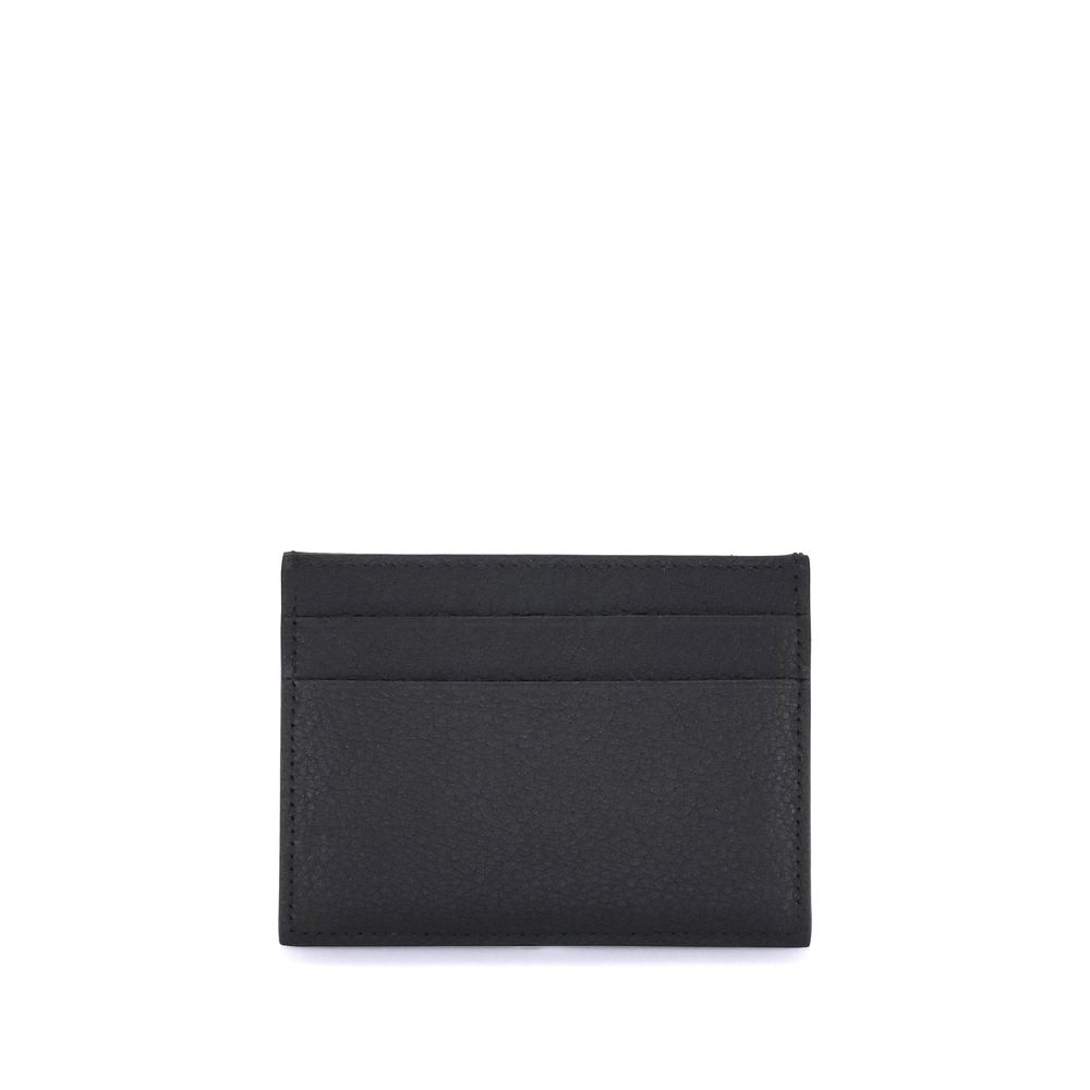 Discover the Balenciaga Black Calf Leather Bos Taurus Wallet, a symbol of refined elegance and artisanal luxury, perfect for the discerning individual.