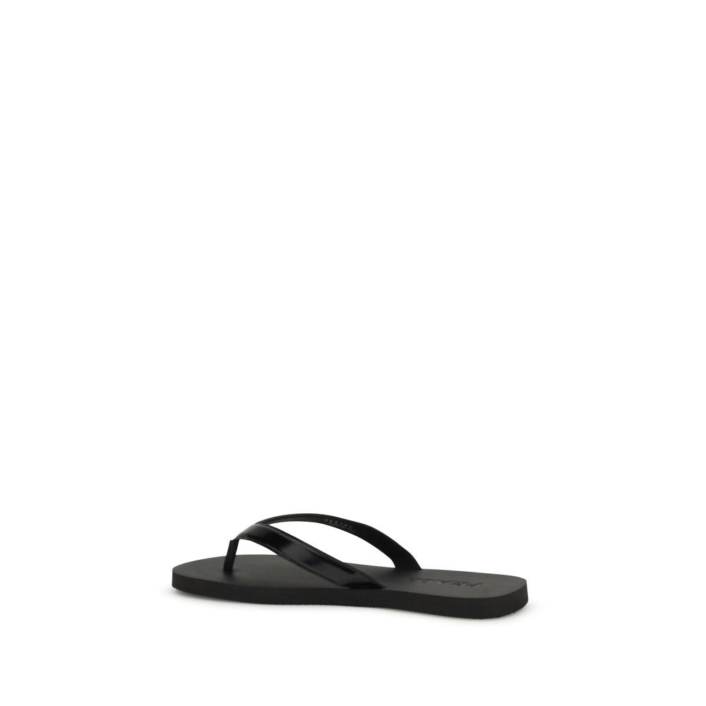 Experience the exquisite allure of Prada's Black Calf Leather Bos Taurus Flip-Flop Sandals, where artisanal craftsmanship meets minimalist elegance for the discerning individual.
