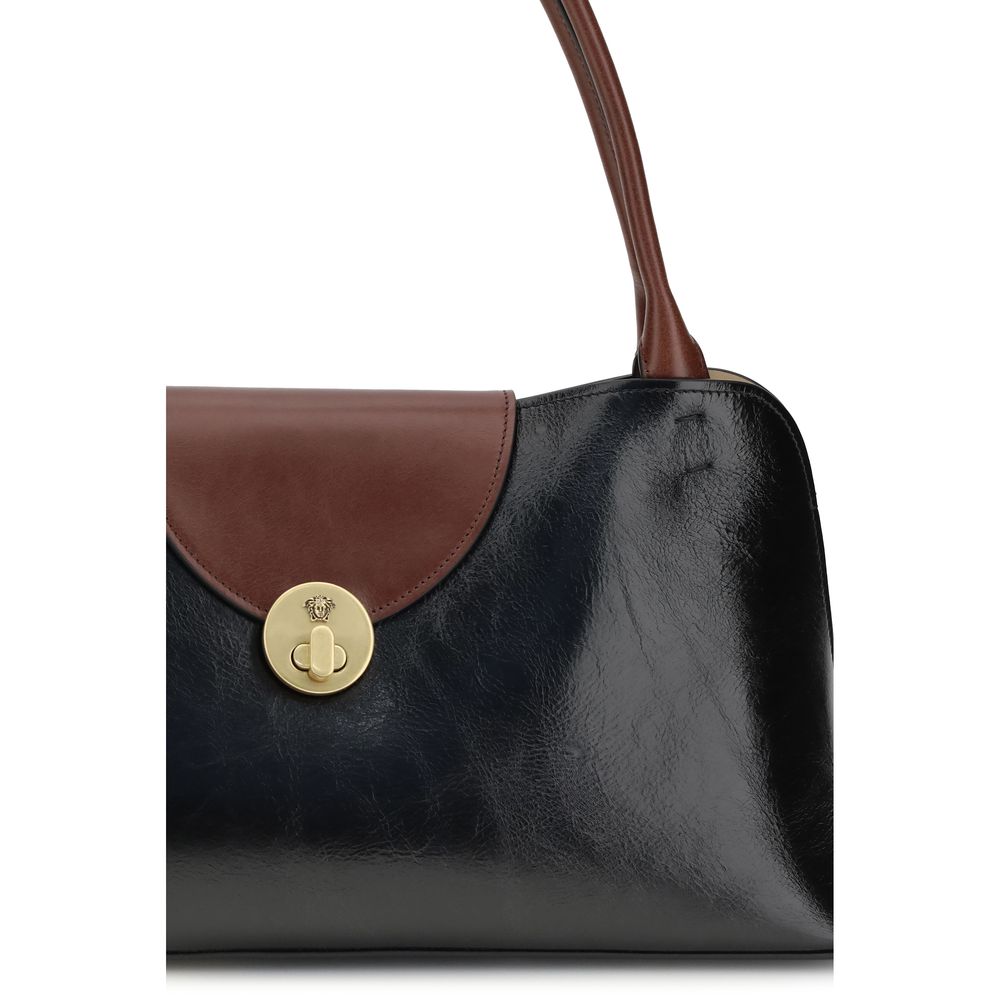 Discover the Versace Black Calf Leather Bos Taurus Shoulder Bag, a luxurious blend of timeless elegance and exquisite craftsmanship, perfect for the discerning connoisseur.