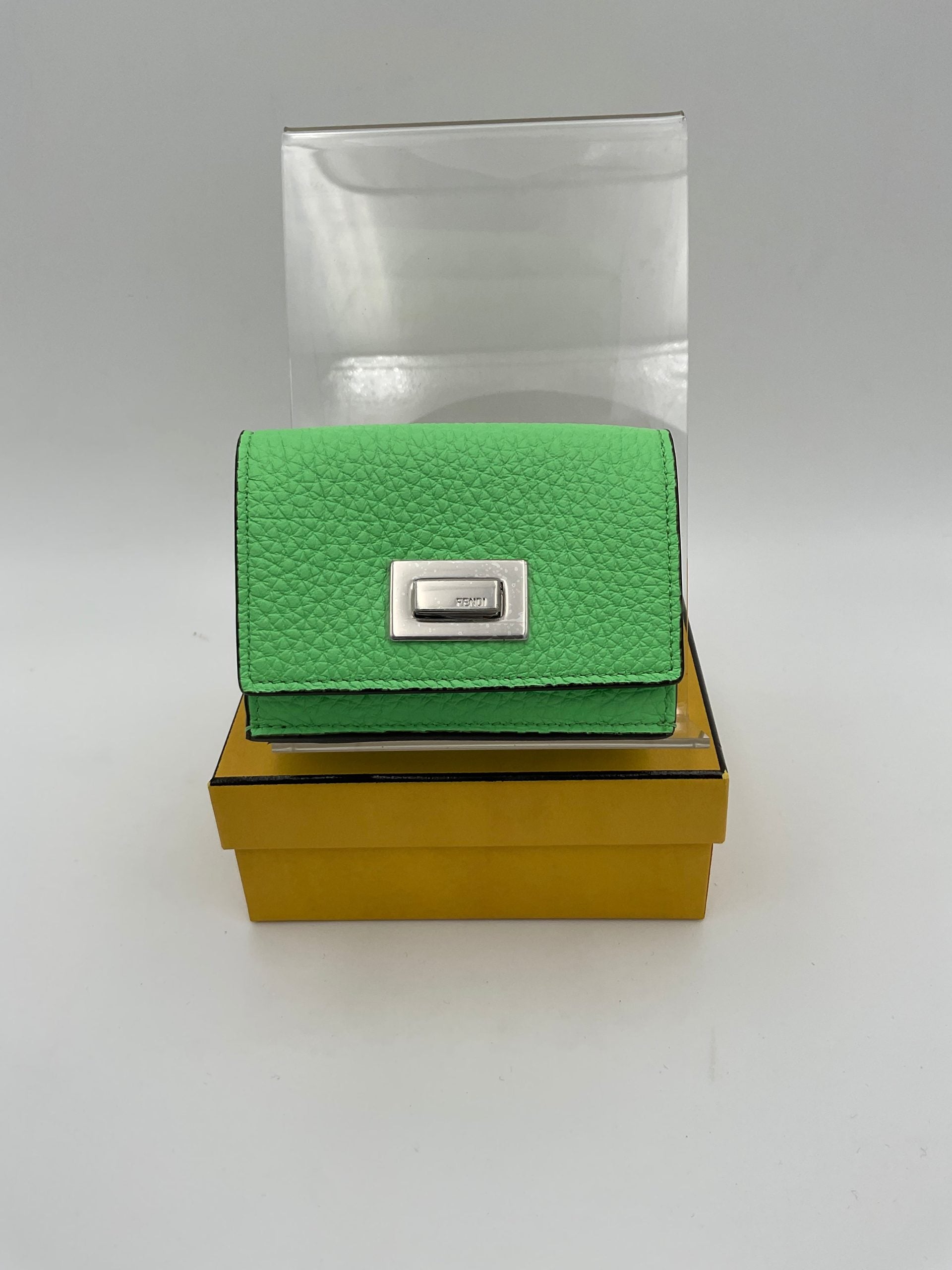 Discover the Fendi PEEKABOO Small Wallet, a masterpiece in Roman and calf leather, embodying timeless luxury and exquisite craftsmanship for the discerning individual.