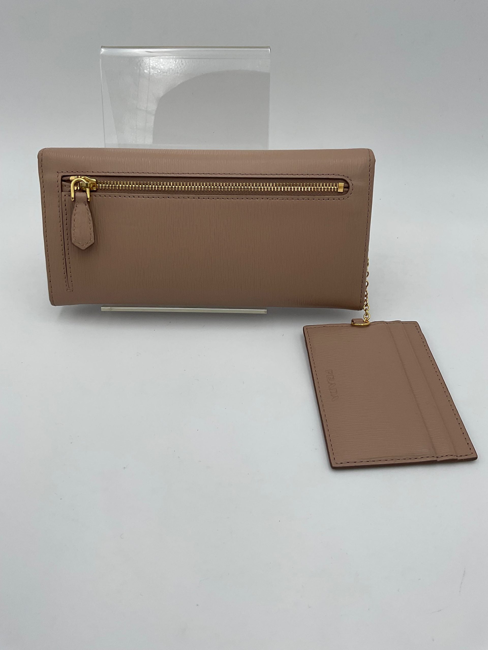 Discover the Prada PRADA Powder Saffiano Wallet, a masterpiece of exquisite craftsmanship and timeless elegance, designed for those who appreciate true luxury.
