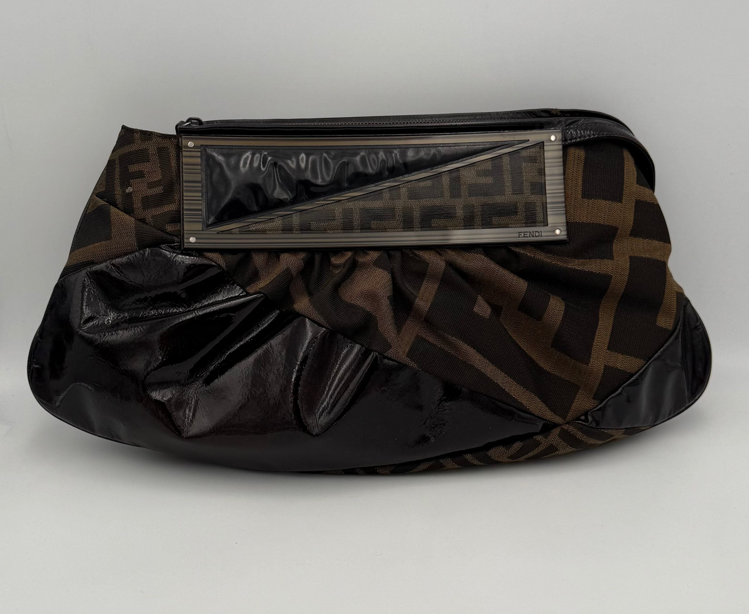 Discover the Fendi FENDI FF Zucca TO YOU Handbag, a luxurious blend of exquisite craftsmanship and iconic design, perfect for elevating any sophisticated ensemble.