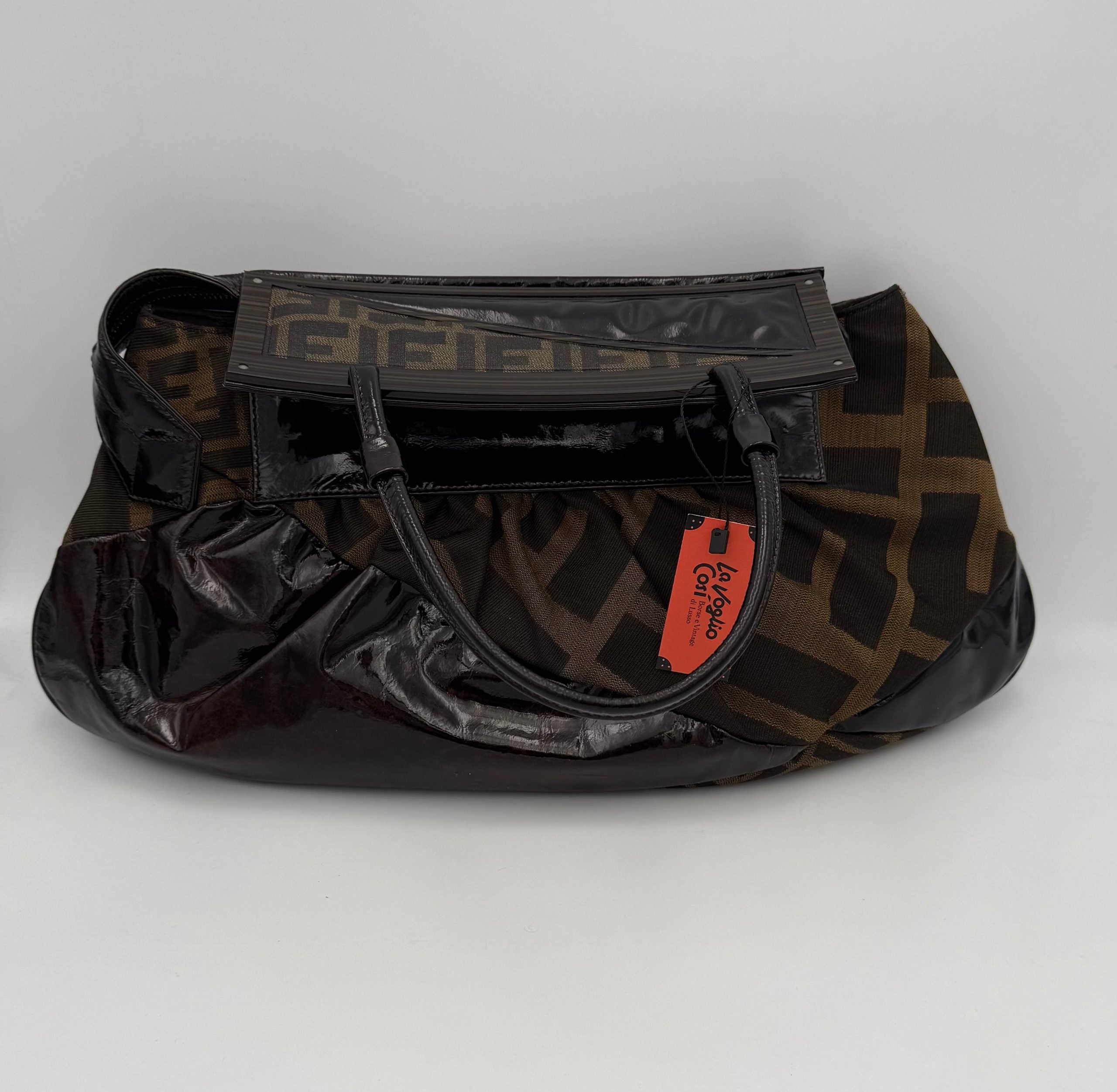Elevate your ensemble with the Fendi FENDI FF Zucca TO YOU Handbag, a symbol of exquisite craftsmanship and timeless elegance, perfect for discerning tastes.