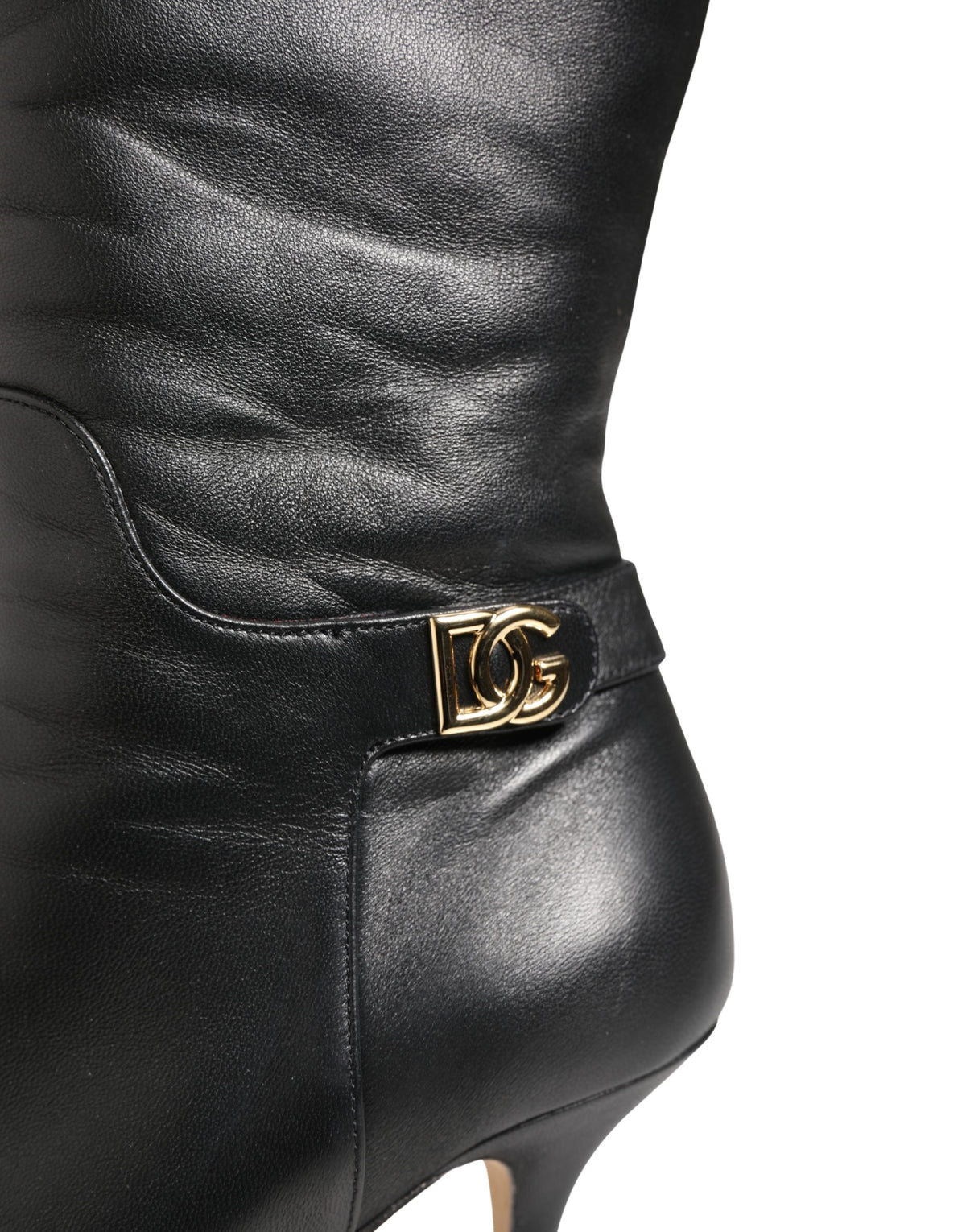 Experience the allure of Dolce & Gabbana's black leather knee-high boots, where exquisite craftsmanship meets timeless elegance for the discerning individual.