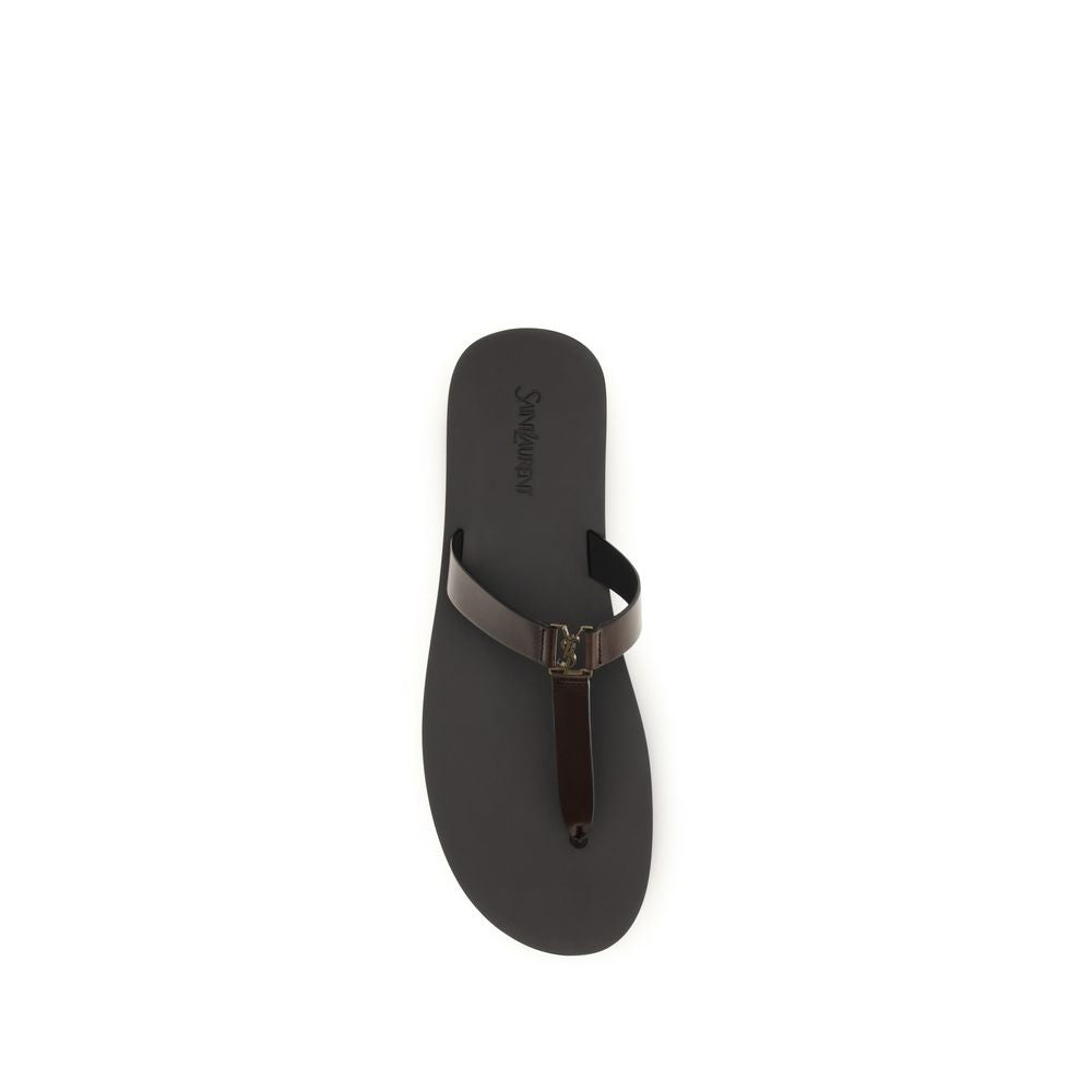 Indulge in the exquisite Saint Laurent Brown Calf Leather Bos Taurus Flat Sandals, where minimalist luxury meets timeless craftsmanship for effortless summer elegance.
