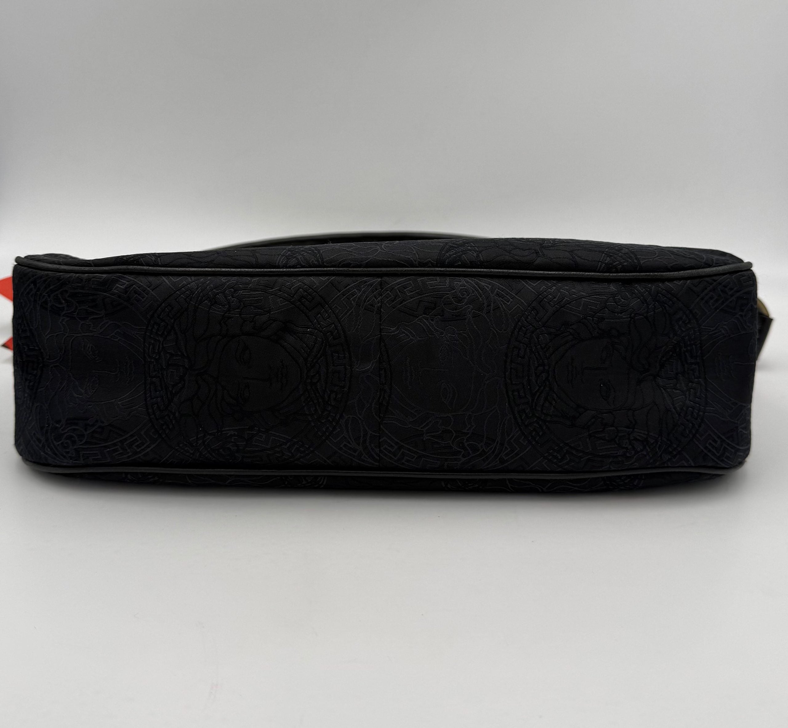 Elevate your style with the Versace VERSACE Medusa Jacquard Shoulder Bag, a luxurious blend of lightweight fabric and black leather, embodying sophistication and versatility for every occasion.