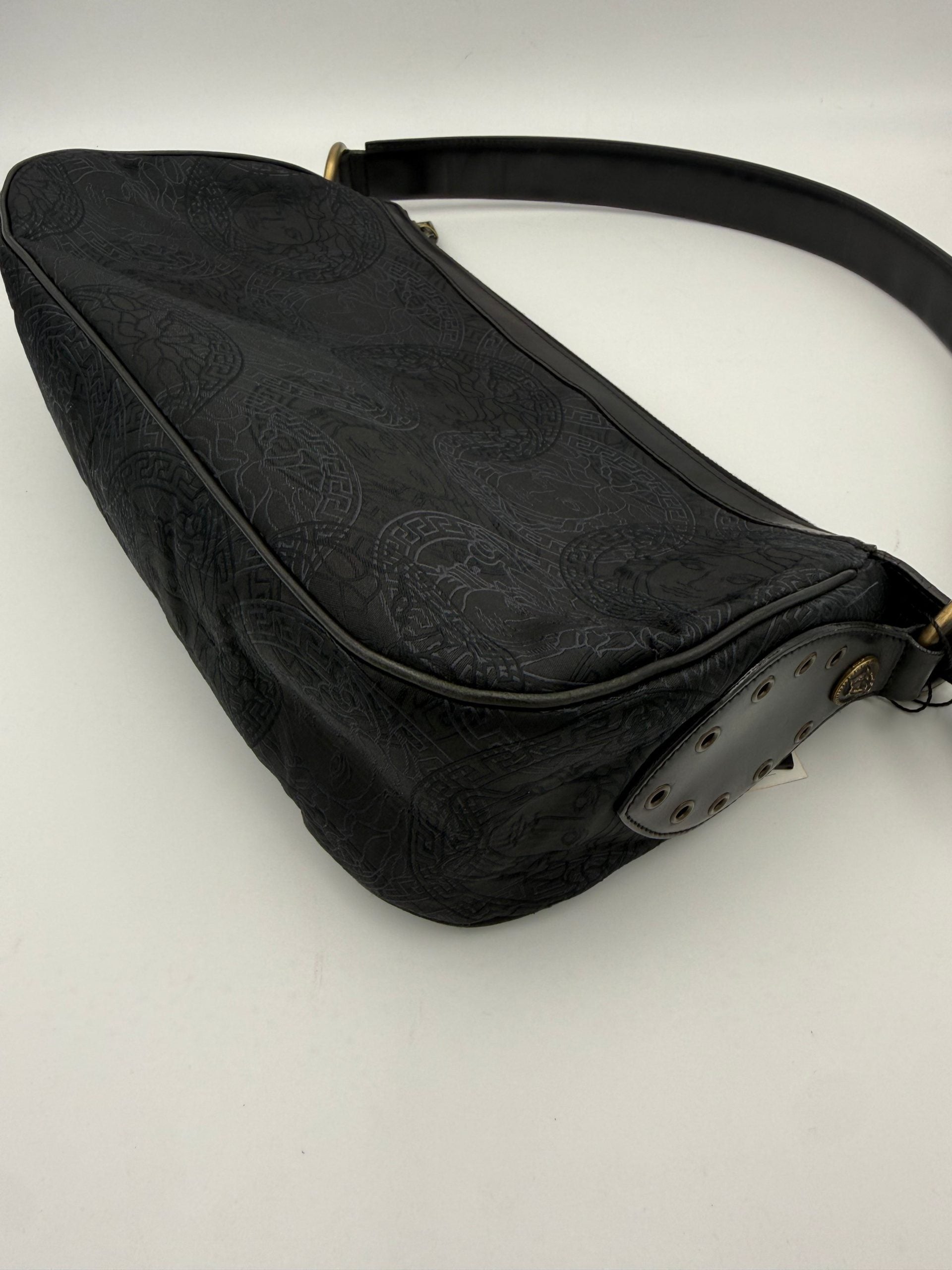 Elevate your style with the Versace VERSACE Medusa Jacquard Shoulder Bag, a luxurious blend of lightweight fabric and black leather, embodying sophistication for every occasion.