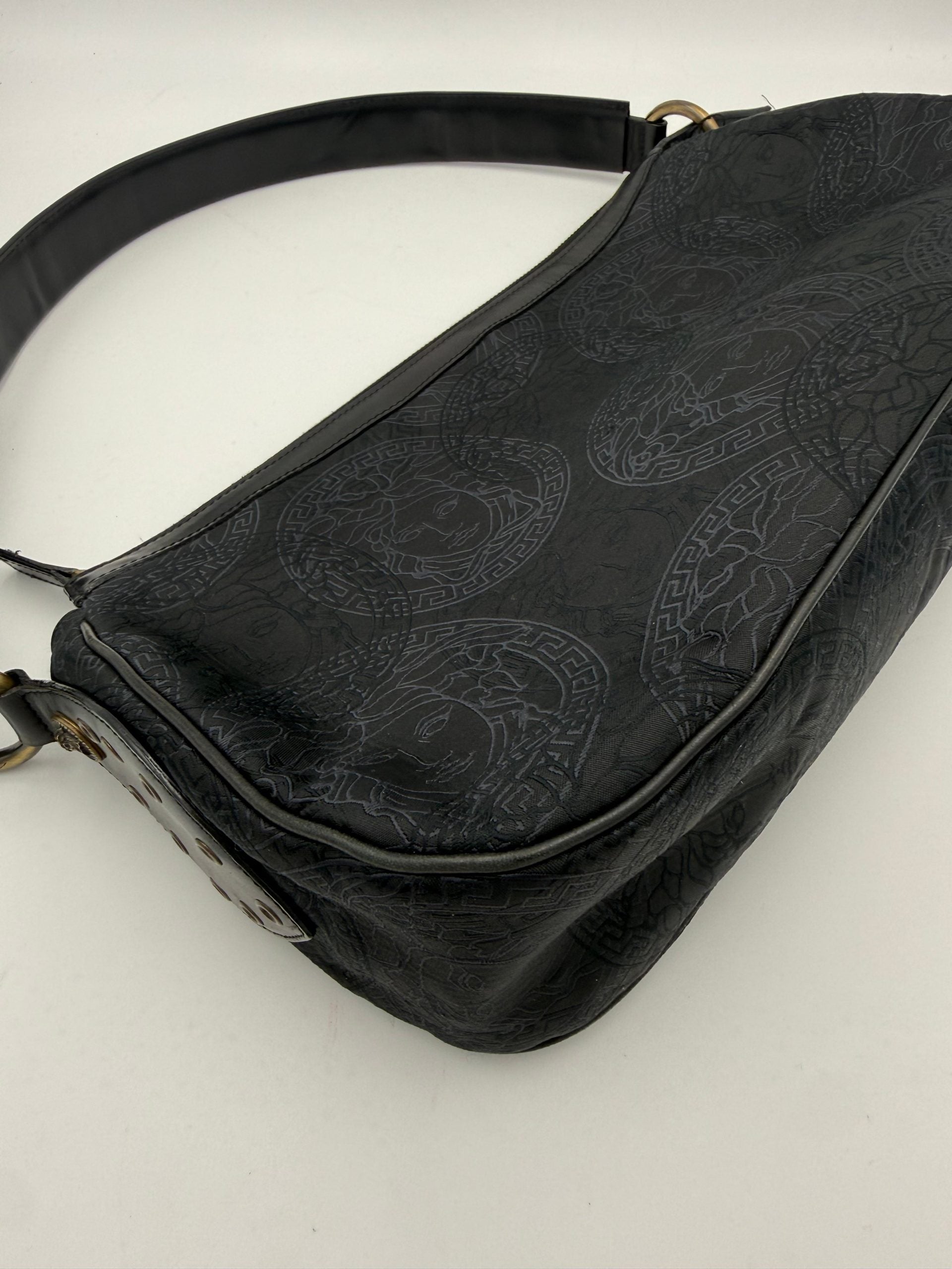Discover the Versace Medusa Jacquard Shoulder Bag, a masterpiece of luxurious craftsmanship and timeless elegance, perfect for elevating your everyday style.