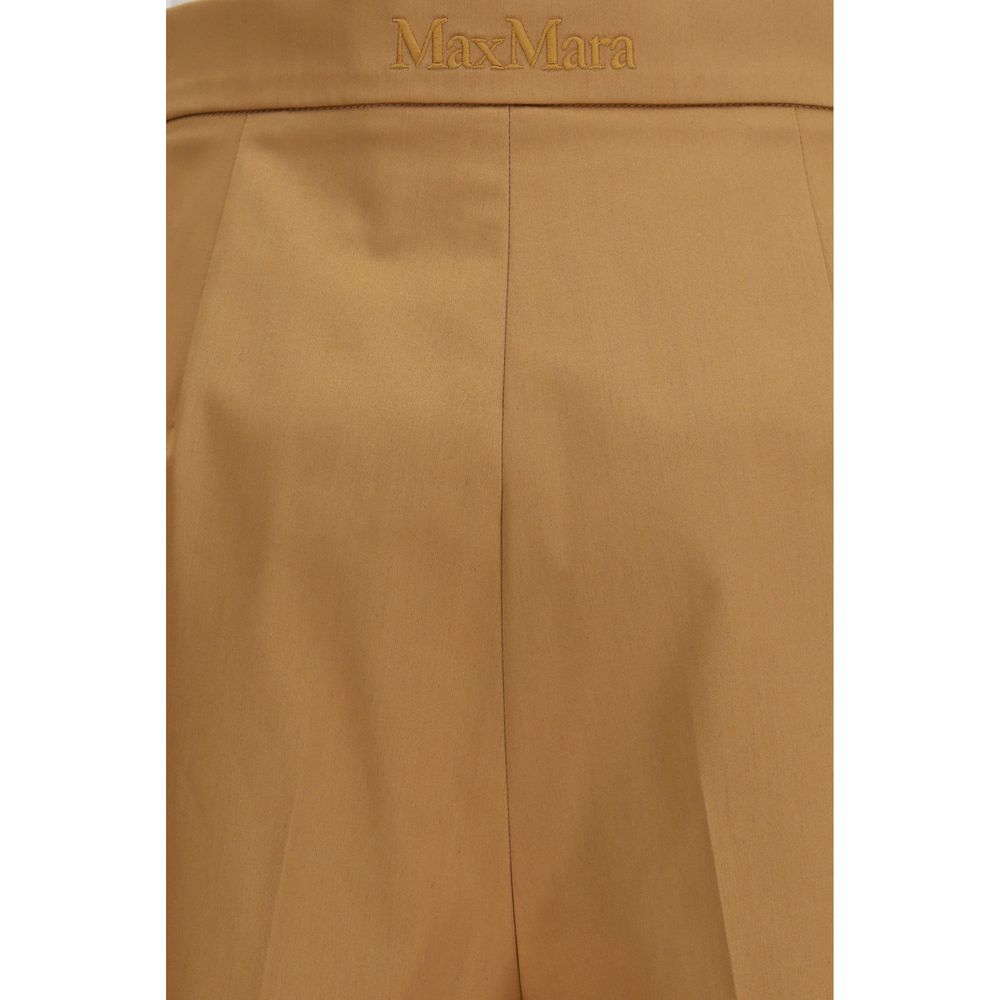 Elevate your wardrobe with Max Mara's Beige Cotton Bermuda Shorts, a luxurious blend of comfort and elegance, perfect for sophisticated moments.