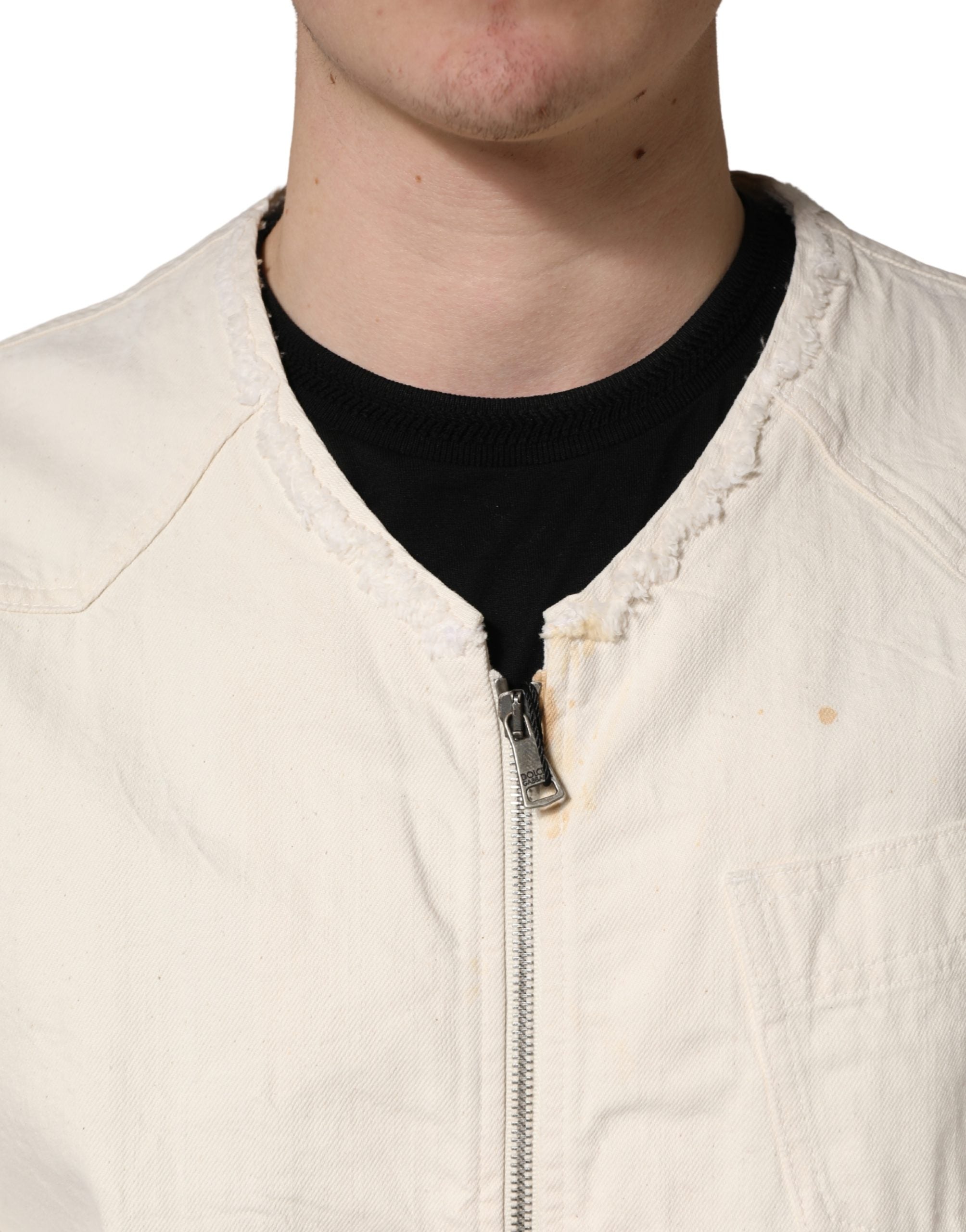 Indulge in the elegance of the Dolce & Gabbana Off White Cotton Full Zip Denim Blouson Jacket, where luxurious craftsmanship meets effortless sophistication for the discerning style connoisseur.