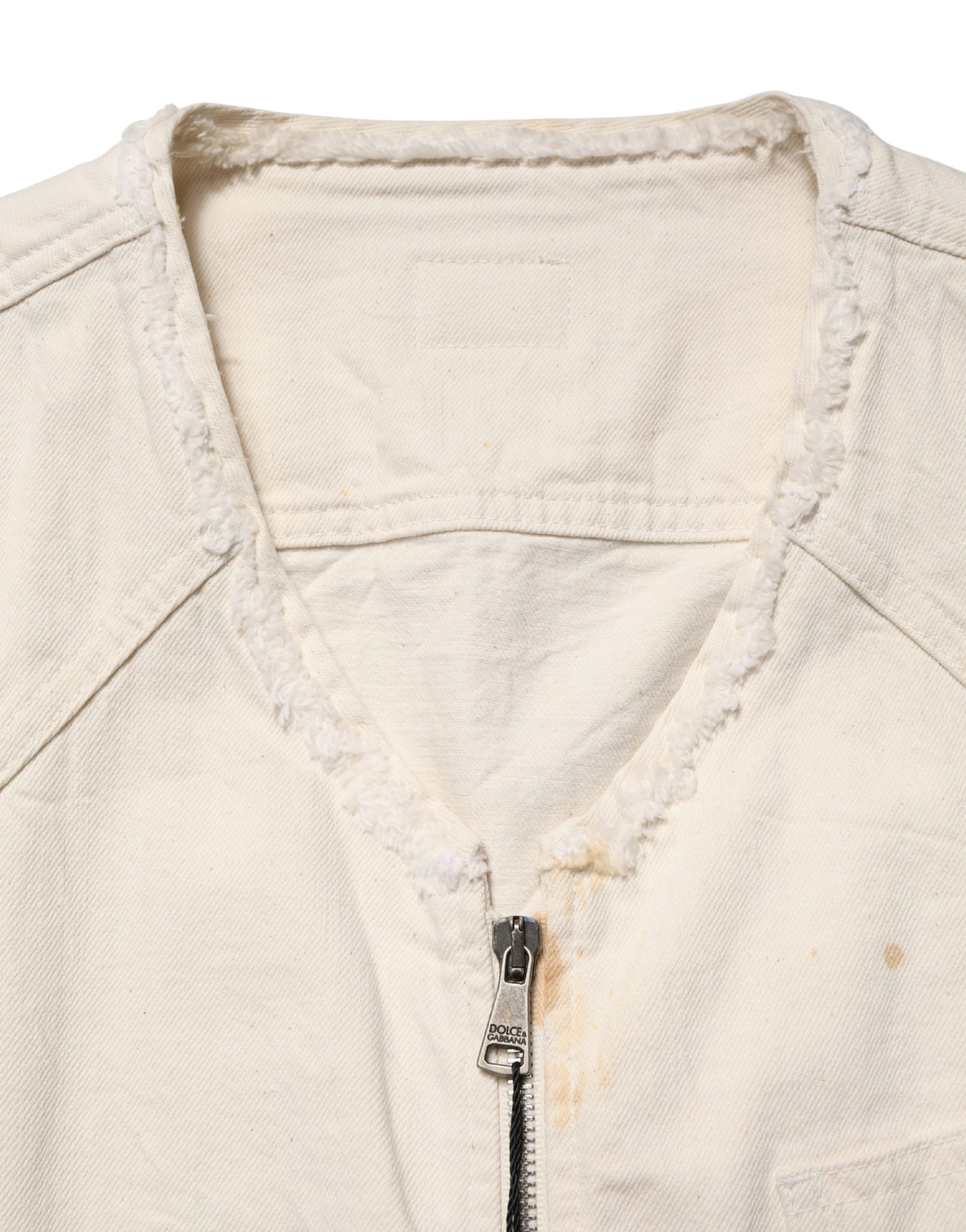 Elevate your style with the Dolce & Gabbana Off White Cotton Full Zip Denim Blouson Jacket, a masterpiece of Italian craftsmanship that embodies effortless luxury and sophistication.