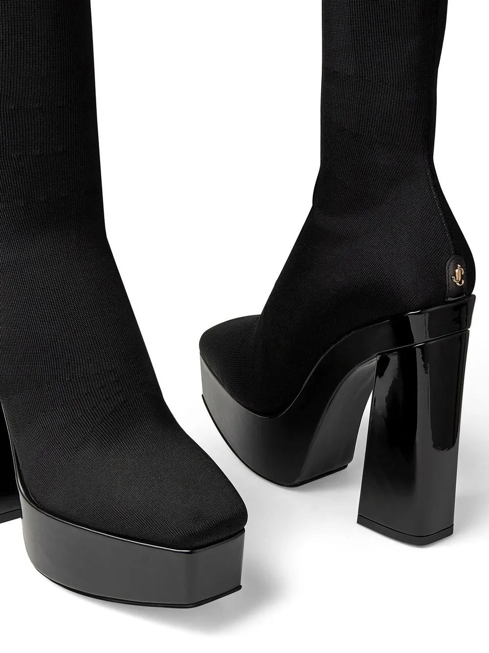 Elevate your allure with the Jimmy Choo Black Fabric Over The Knee boots, a masterpiece of craftsmanship that embodies luxury and sophistication for unforgettable evenings.