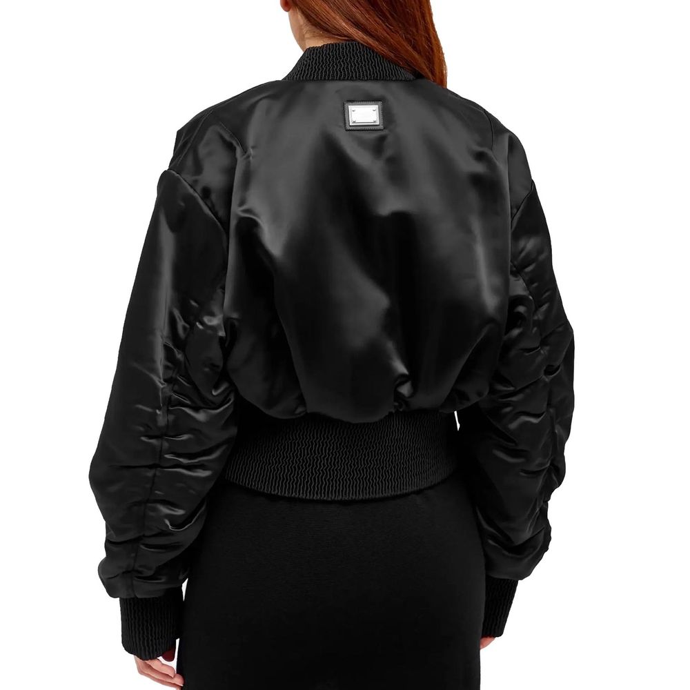 Discover the Dolce & Gabbana Black Acetate Bomber, a luxurious masterpiece of Italian craftsmanship, perfect for elevating your style with timeless elegance.