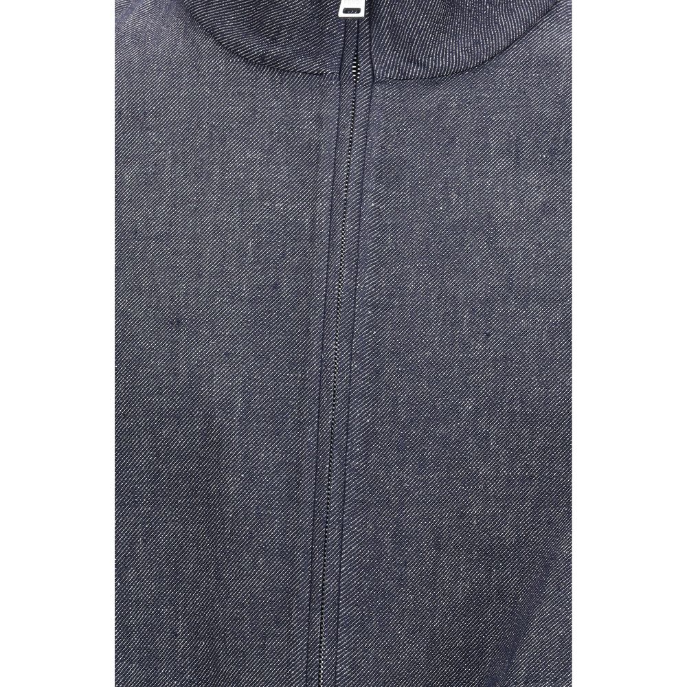 Experience the Fendi Blue Linen Denim Jacket, a luxurious blend of linen, cotton, and silk, redefining elegance for the discerning fashion connoisseur.