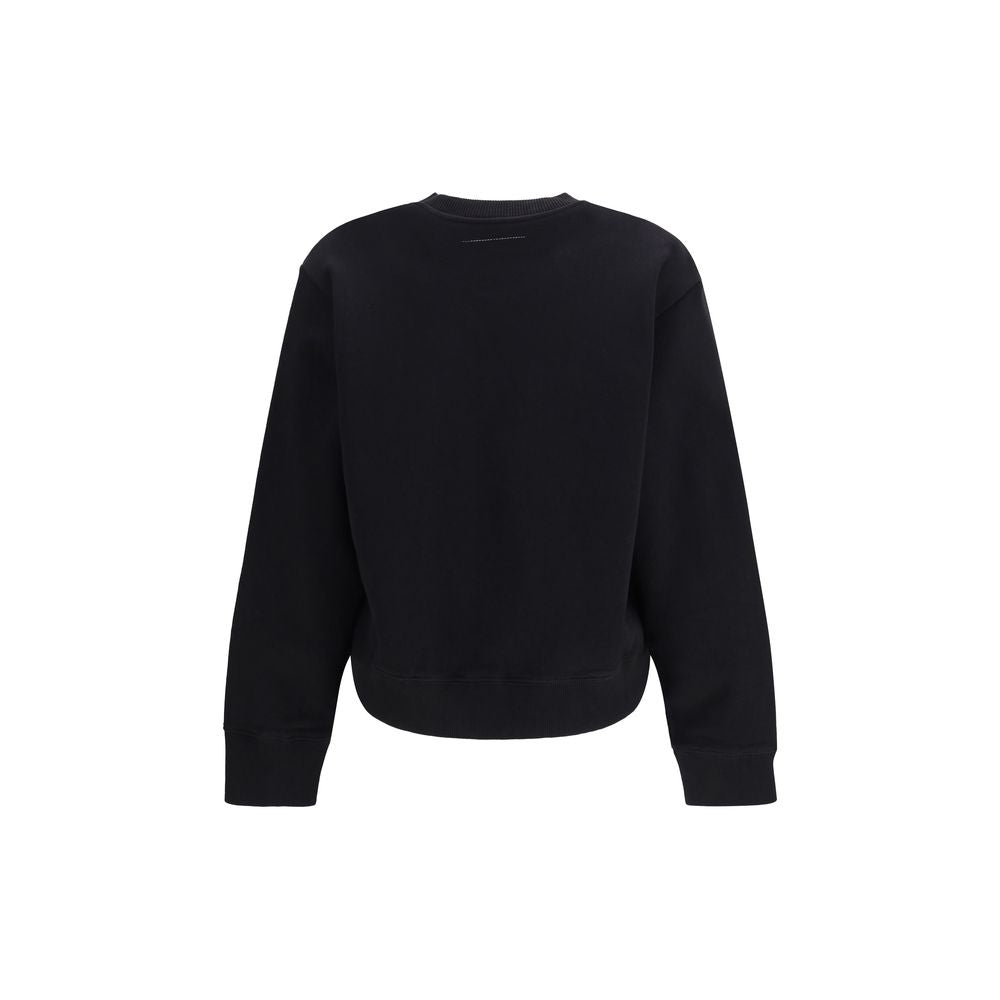 Indulge in the MM6 Black Cotton Sweatshirt, a masterpiece of 100% high-quality cotton, blending effortless elegance with contemporary allure for the discerning fashion aficionado.