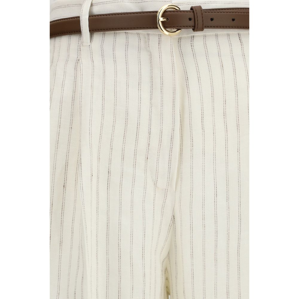 Discover the Max Mara Beige Linen Casual Pants, crafted from pure linen for a sophisticated wide-leg silhouette that embodies timeless elegance and effortless luxury.