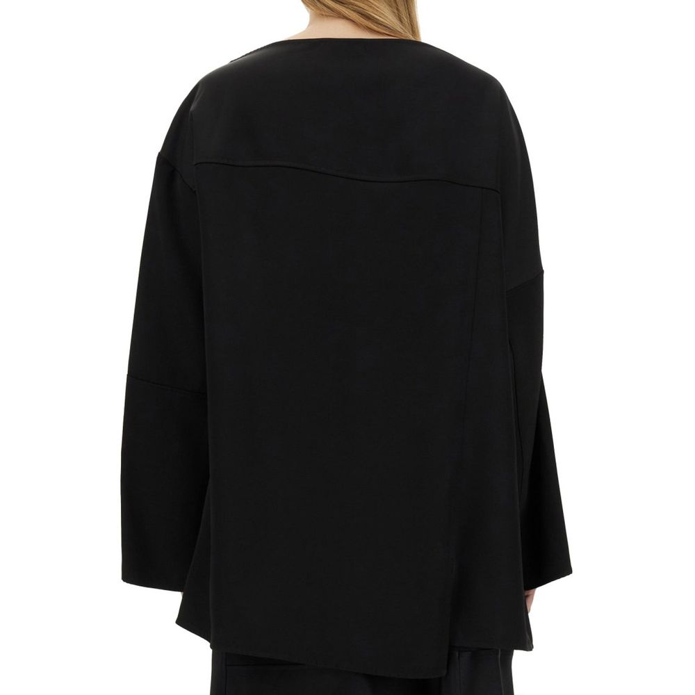 Elevate your wardrobe with the Jil Sander Black Silk Blouse, a luxurious blend of silk and viscose, embodying Italian craftsmanship and timeless elegance.