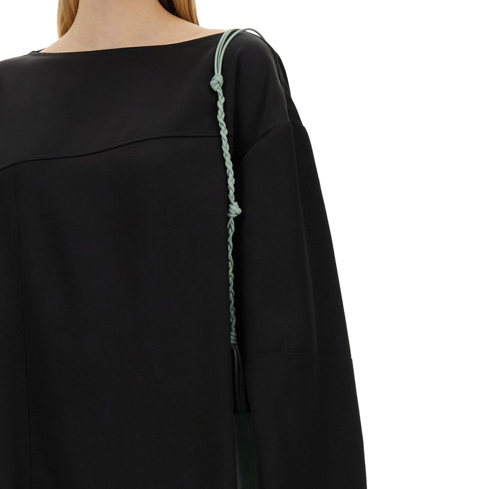 Experience the allure of the Jil Sander Black Silk Blouse, where exquisite silk and viscose meet Italian craftsmanship, embodying timeless elegance for the discerning individual.