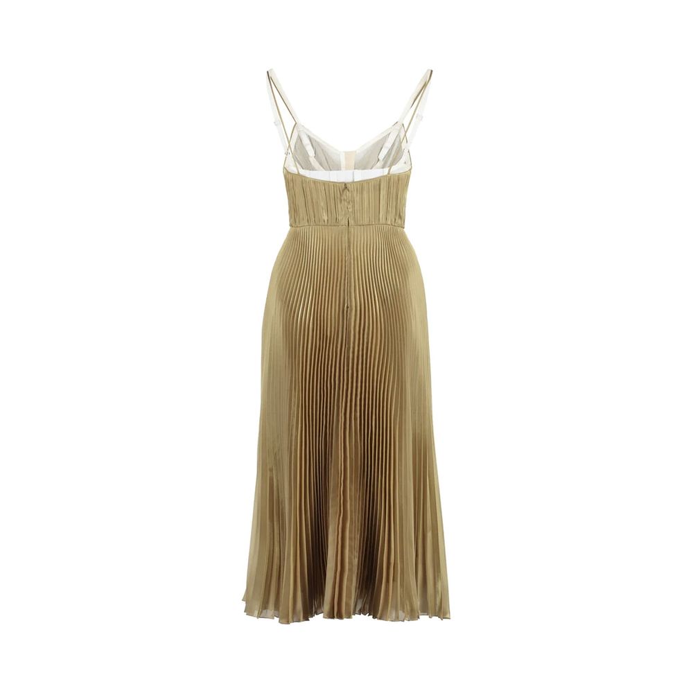 Discover the Prada Gold Polyester Casual Dress, a masterpiece of Italian craftsmanship, designed for those who embrace elegance and sophistication in every moment.