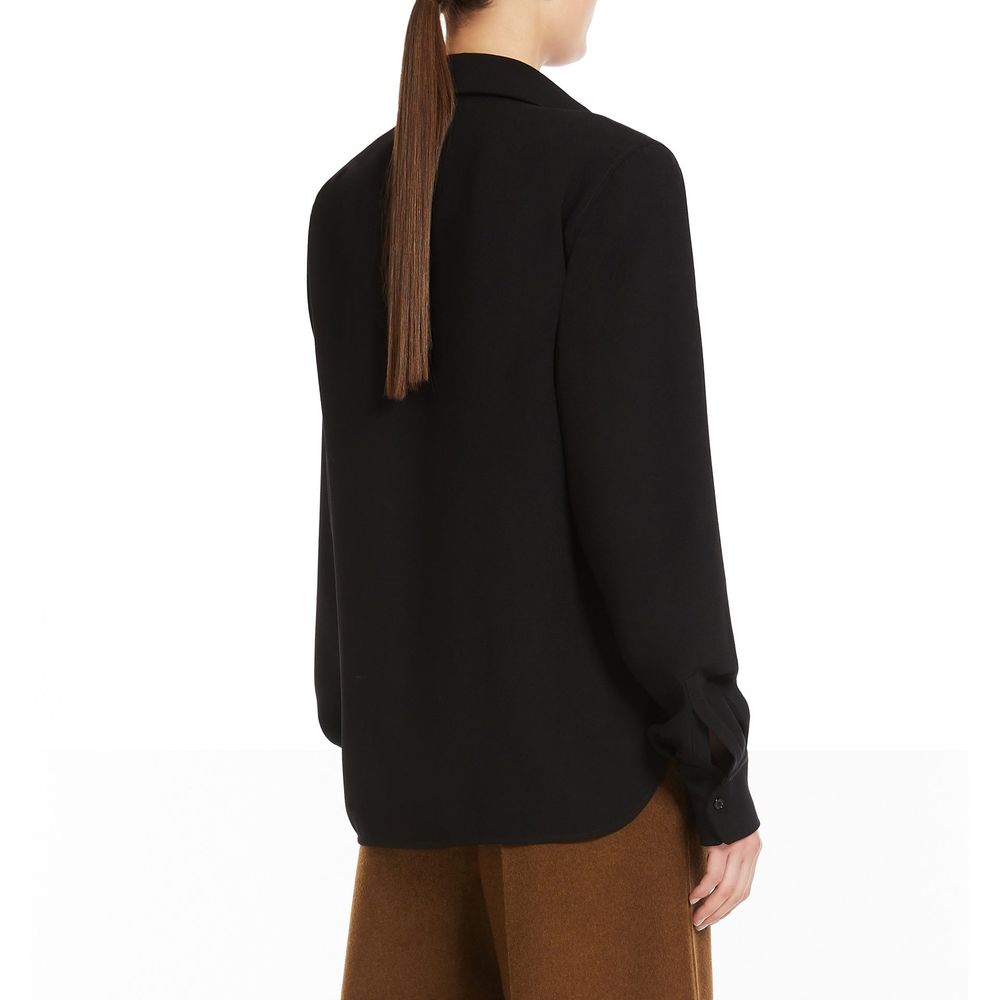 Discover the Max Mara Black Cotton Dress Shirt, a masterpiece of Italian craftsmanship in 100% cotton, epitomizing timeless elegance and sophisticated allure.
