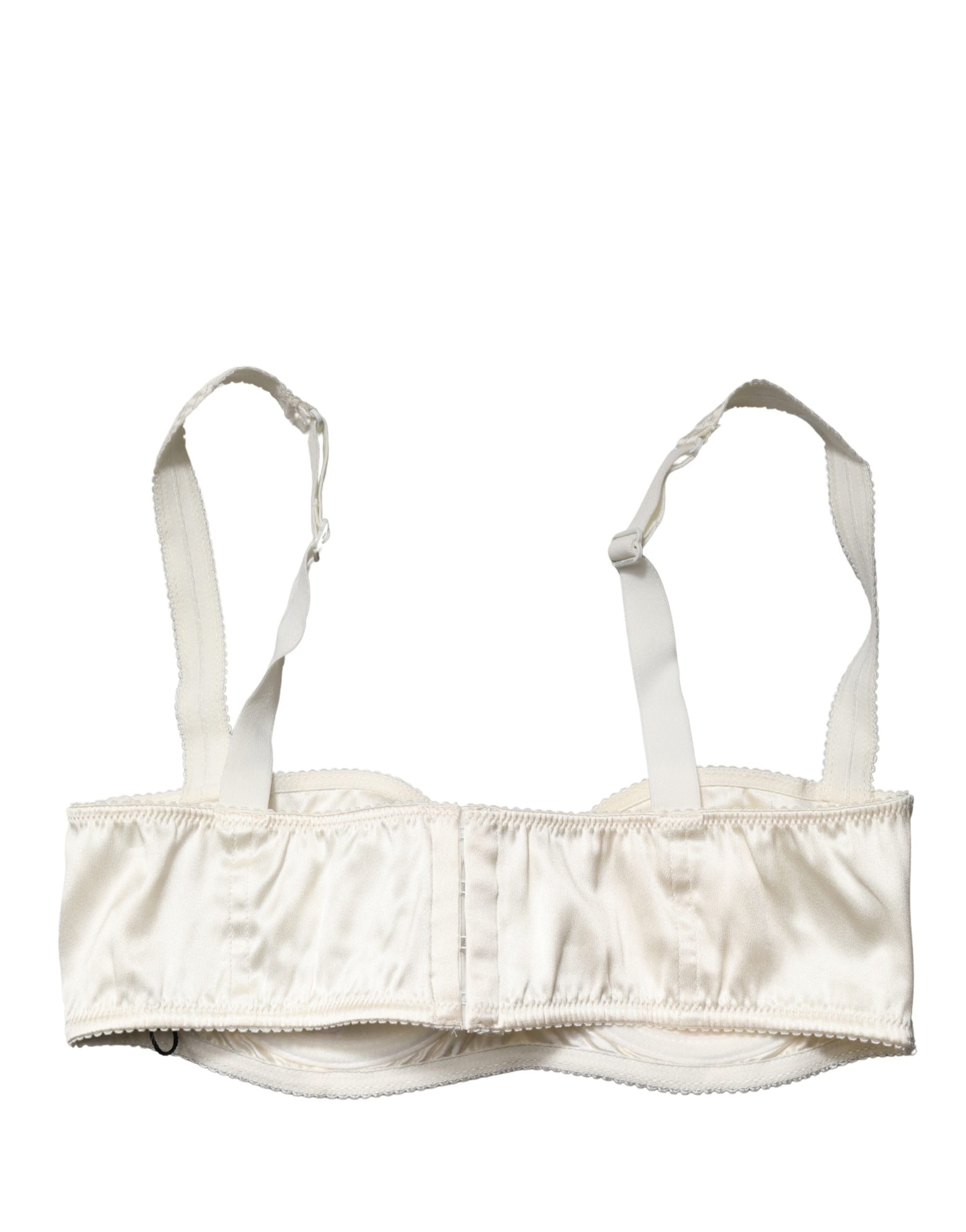 Experience the allure of Dolce & Gabbana's Off White Semi-Pad Underwire Balconette Bra, where exquisite silk meets Italian craftsmanship, embodying timeless elegance and sophistication.