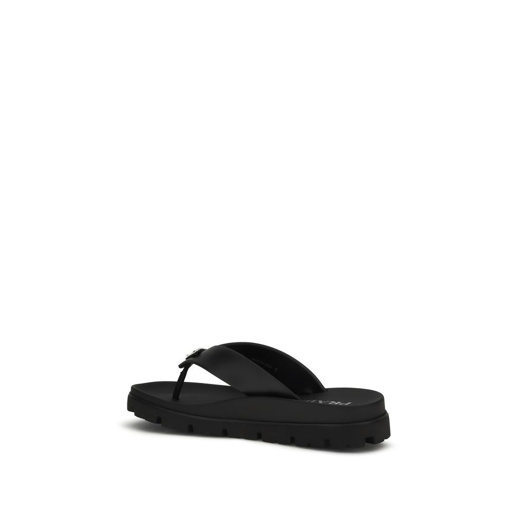 Step into a realm of sophistication with Prada's Brown Calf Leather Bos Taurus Flip-Flop Sandals, crafted for those who embrace luxury and elegance in every stride.