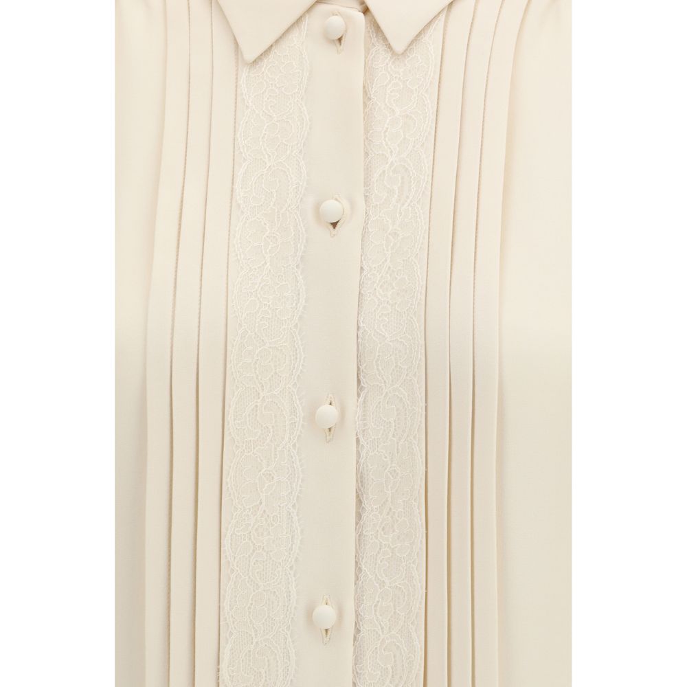 Experience the allure of Valentino's Beige Silk Shirt, a masterpiece of tailored elegance in 100% silk, perfect for those who embrace luxury and sophistication.