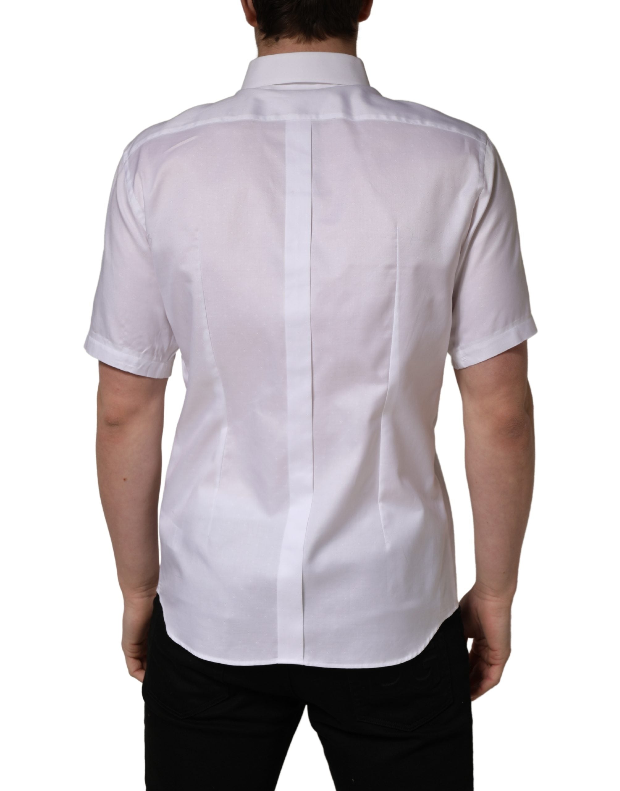 Discover the exquisite Dolce & Gabbana White Cotton Short Sleeves Button Down Shirt, a testament to Italian craftsmanship that elevates your style with timeless elegance.