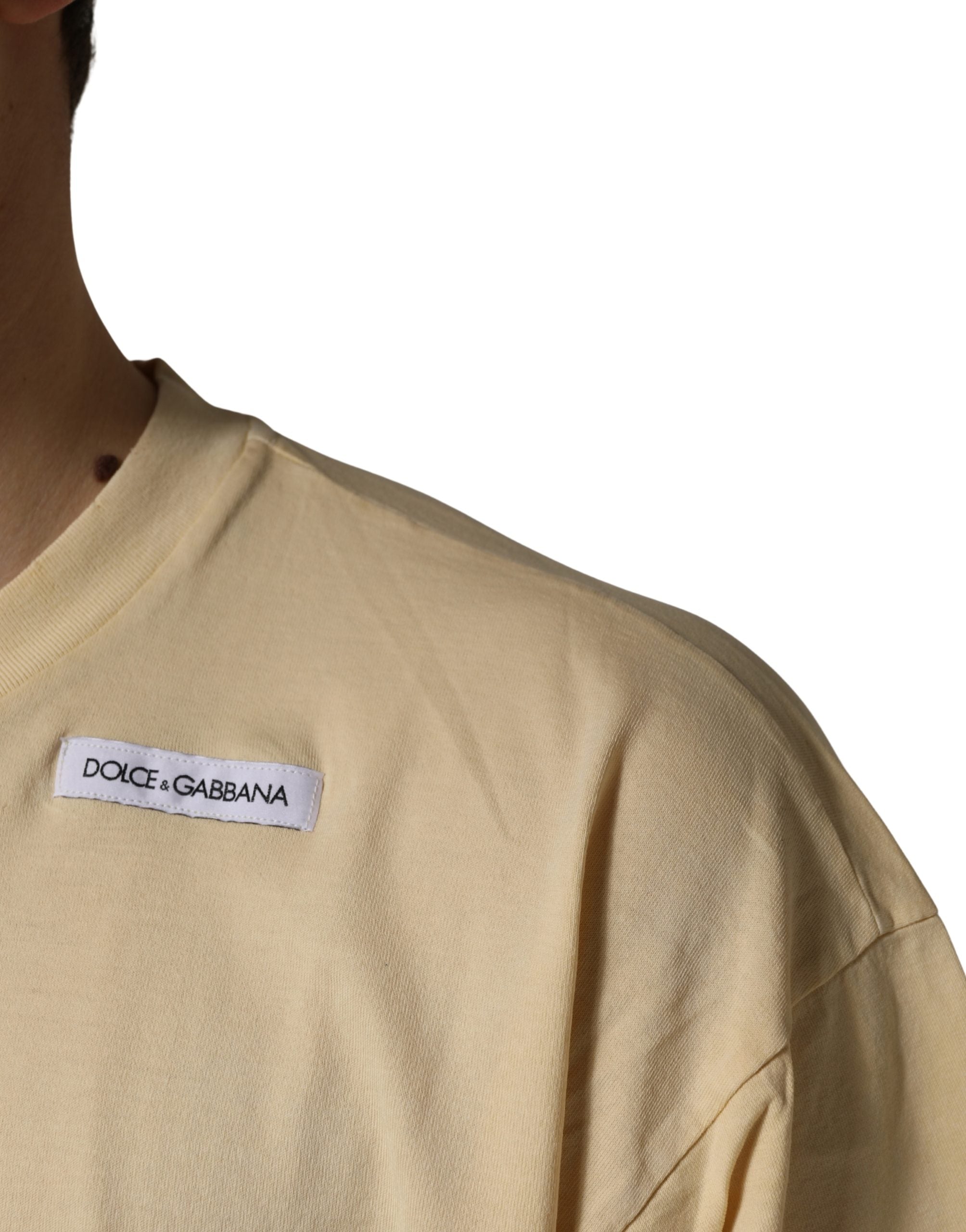 Indulge in the essence of Italian luxury with the Dolce & Gabbana Yellow Logo Print Cotton Crew Neck T-shirt, a timeless piece that embodies exquisite craftsmanship and effortless elegance.