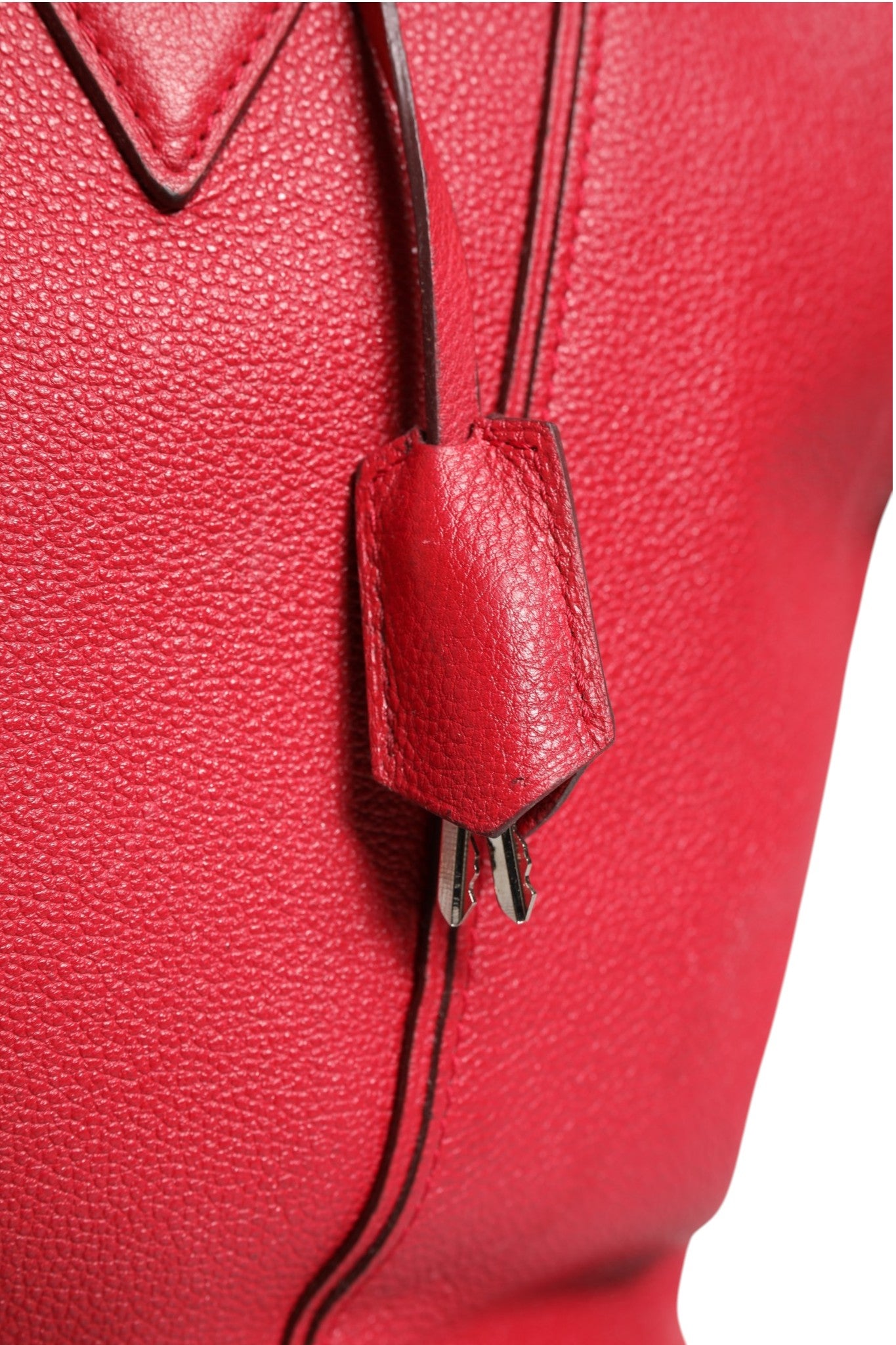 Experience the allure of the Louis Vuitton Griotte Taurillon Leather Soft Lockit MM Crossbody Bag, a masterpiece of craftsmanship that embodies timeless luxury and sophistication.