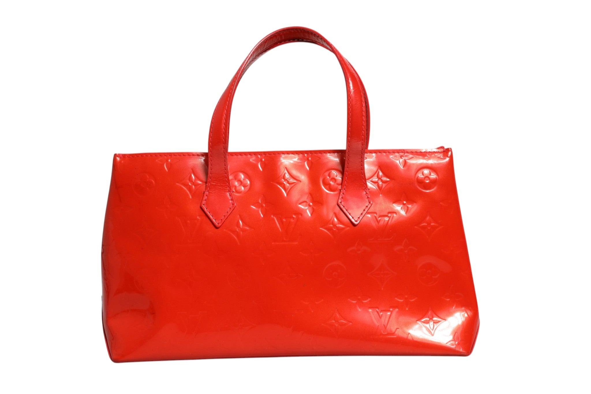 Experience the allure of the Louis Vuitton Red Monogram Vernis Wilshire PM, a masterpiece of exquisite craftsmanship and timeless elegance, perfect for the discerning individual.