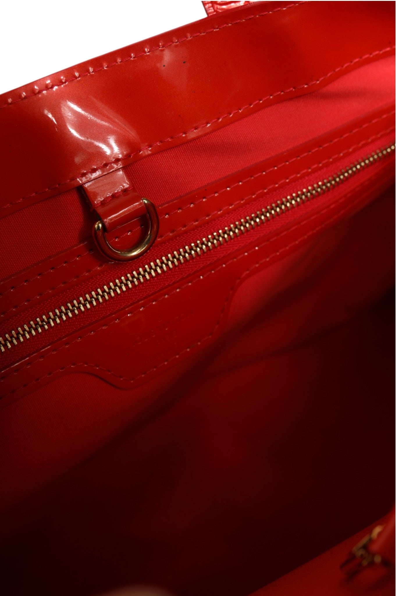 Indulge in the timeless elegance of the Louis Vuitton Red Monogram Vernis Wilshire PM, a luxurious handbag that embodies exquisite craftsmanship and sophisticated allure.