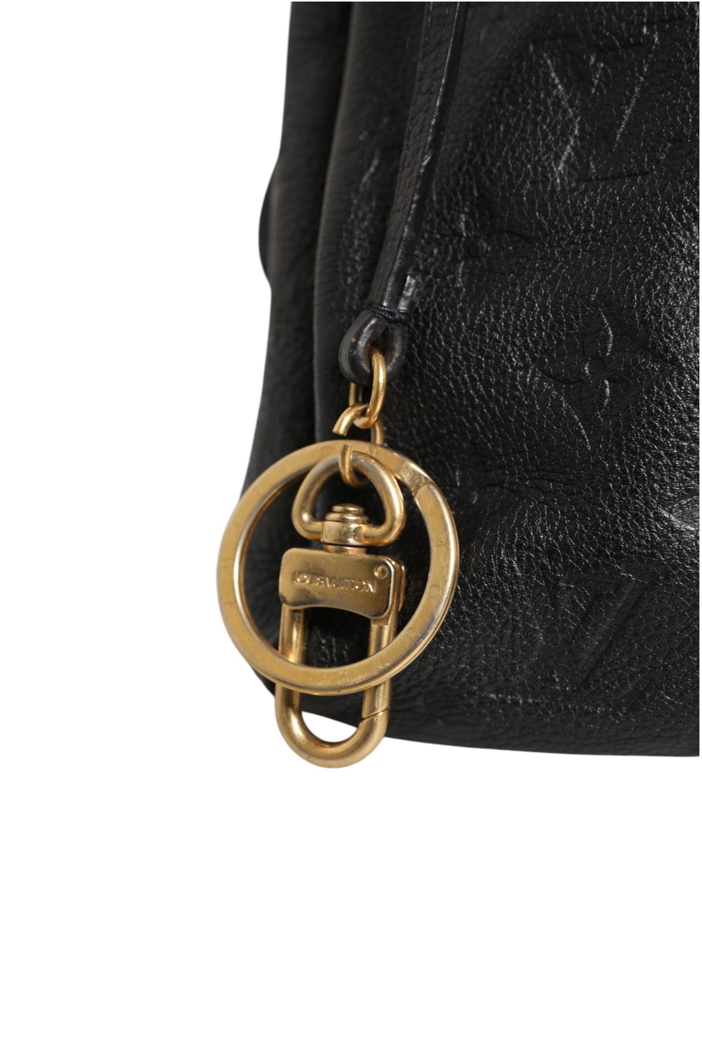 Indulge in the timeless elegance of the Louis Vuitton Black Monogram Empreinte Artsy MM Handbag, a masterpiece of exquisite craftsmanship that elevates your style with luxurious allure.