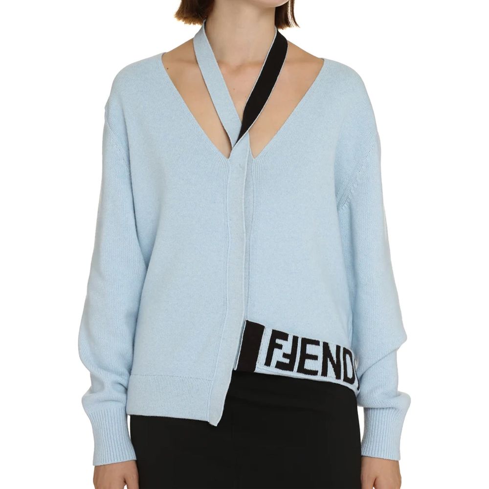 Elevate your wardrobe with the Fendi Blue Cashmere Cardigan, a luxurious blend of cashmere and wool, embodying timeless elegance and Italian craftsmanship.