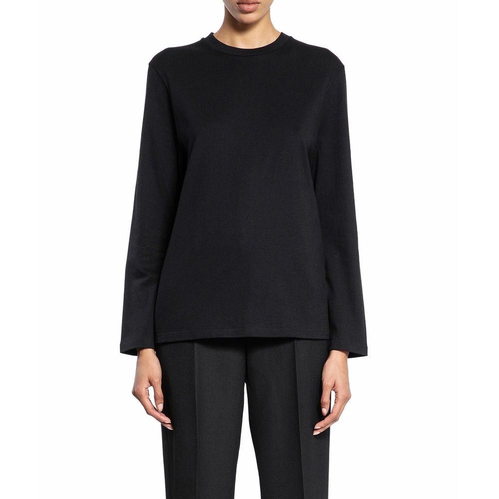 Discover the Jil Sander Black Cotton Long Sleeve T-Shirt, a masterpiece of Italian craftsmanship, blending elegance and comfort for the discerning wardrobe.